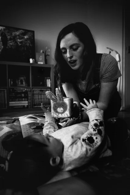 Black and white photograph of mother and her baby