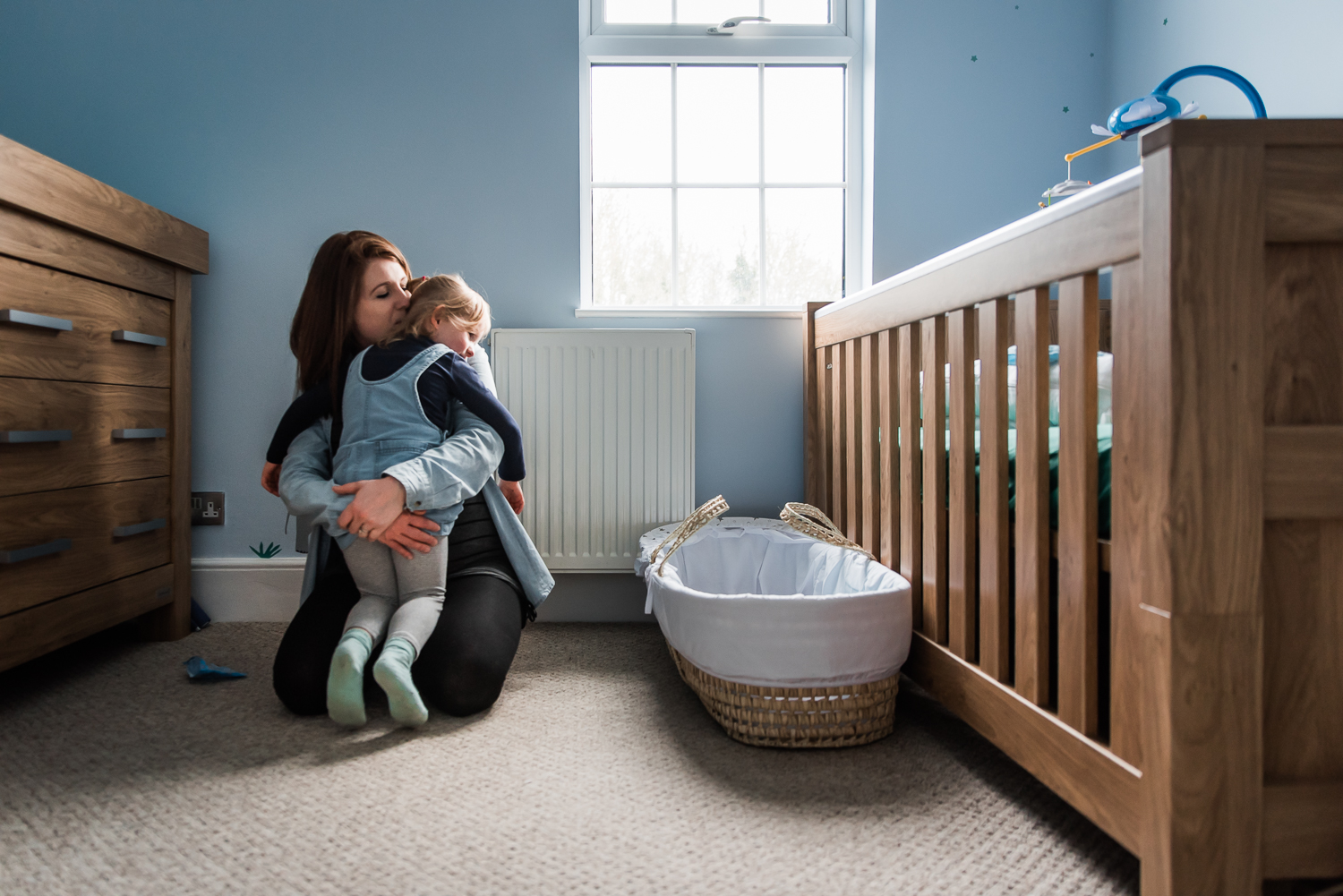 Cuddles in the baby nursery