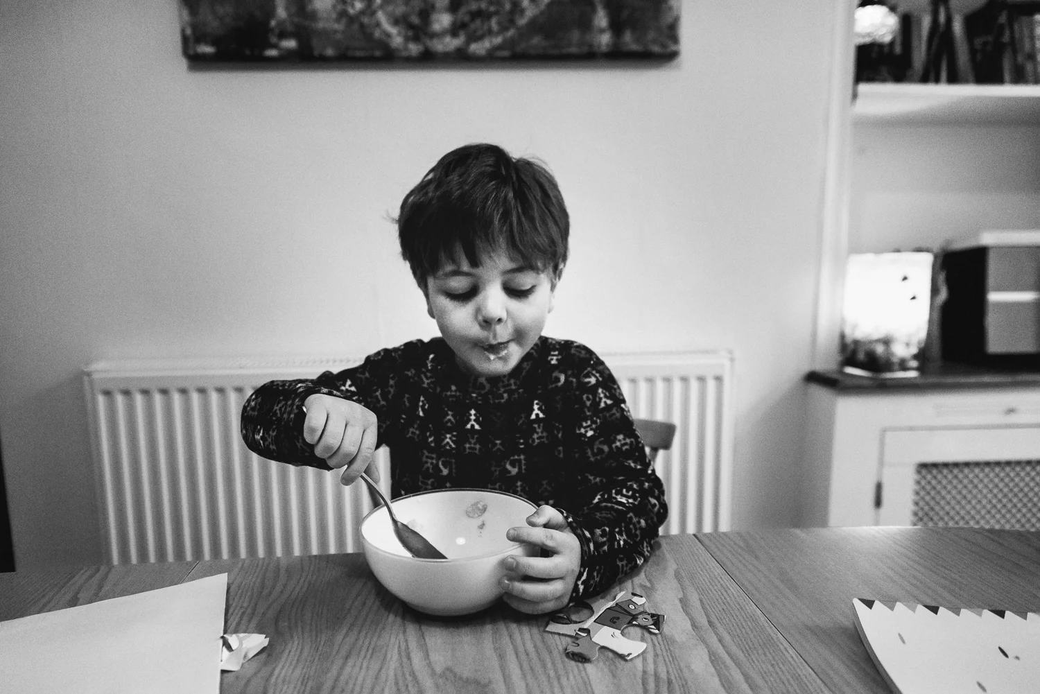 Copy of Breakfast scene boy eating his bowl of cereal with milk moustach