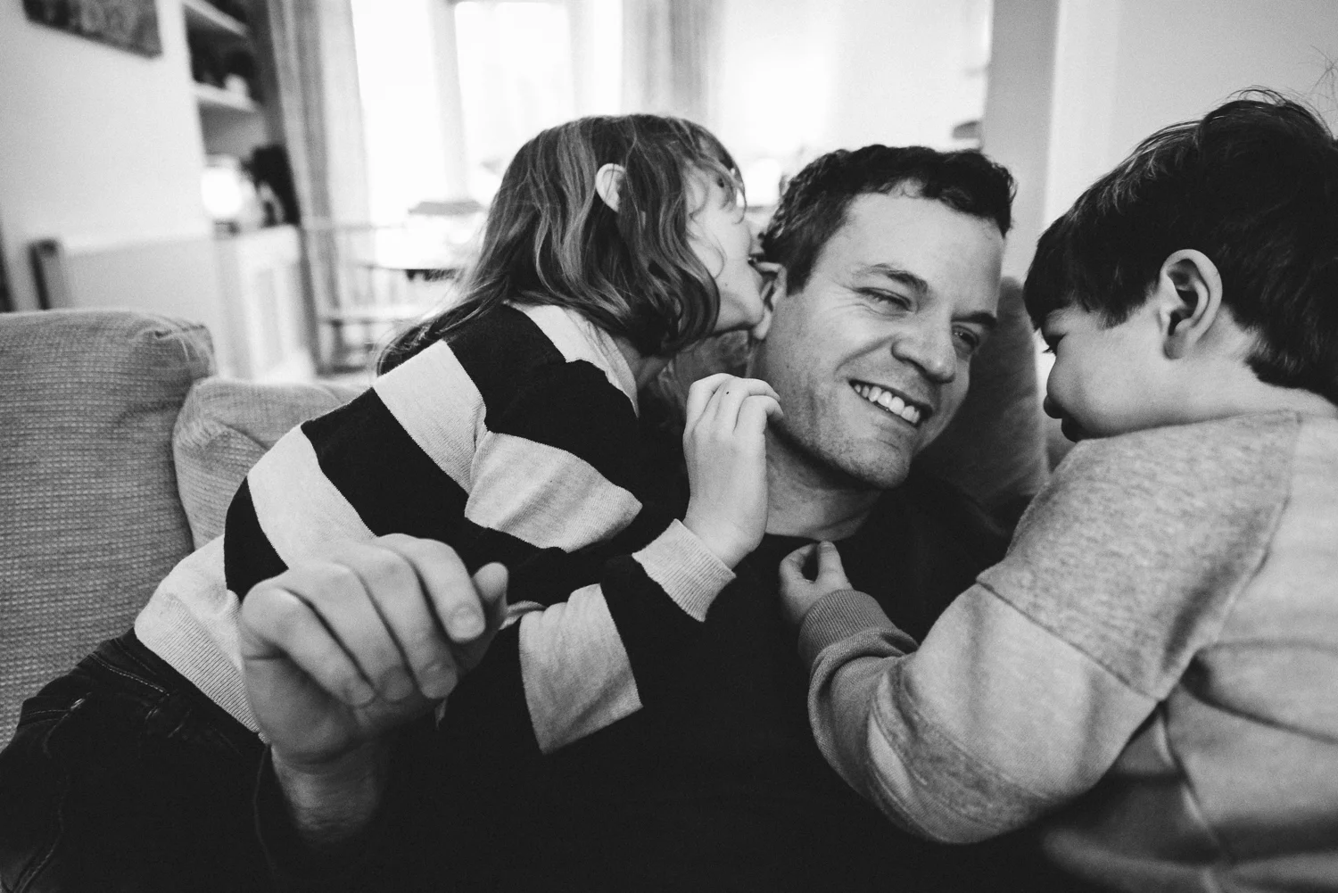 Copy of dad and his two children share a tender moment together - Diana