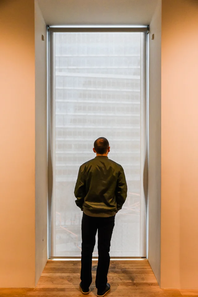 Man standing at window in Tate gallery, London
