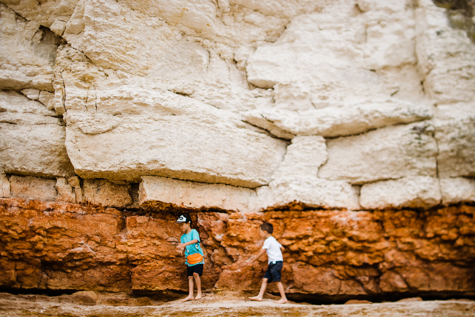 Children playing on the sandstone cliffs at Old Hunstanton