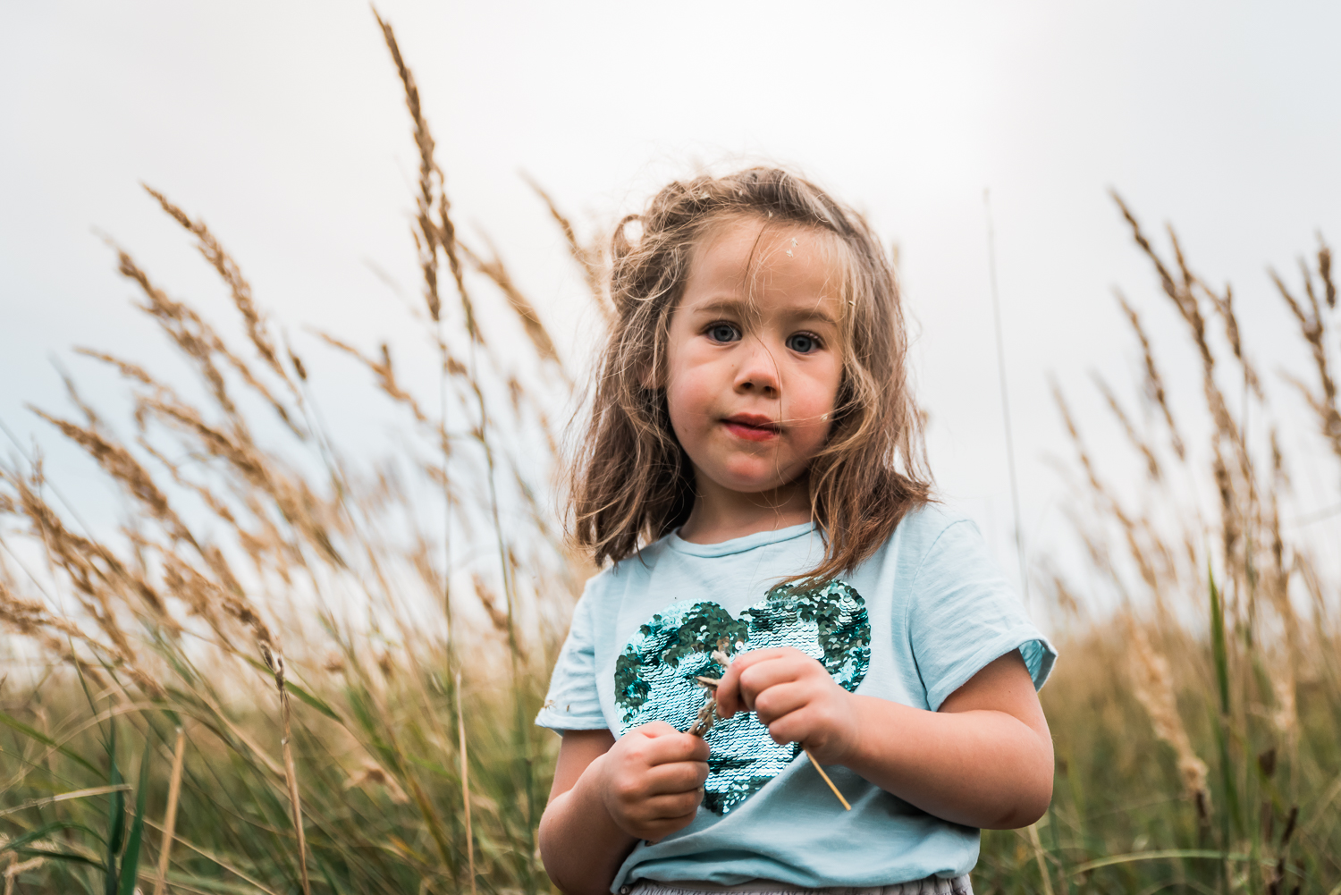 Portrait of a child with grass seeds in her hair