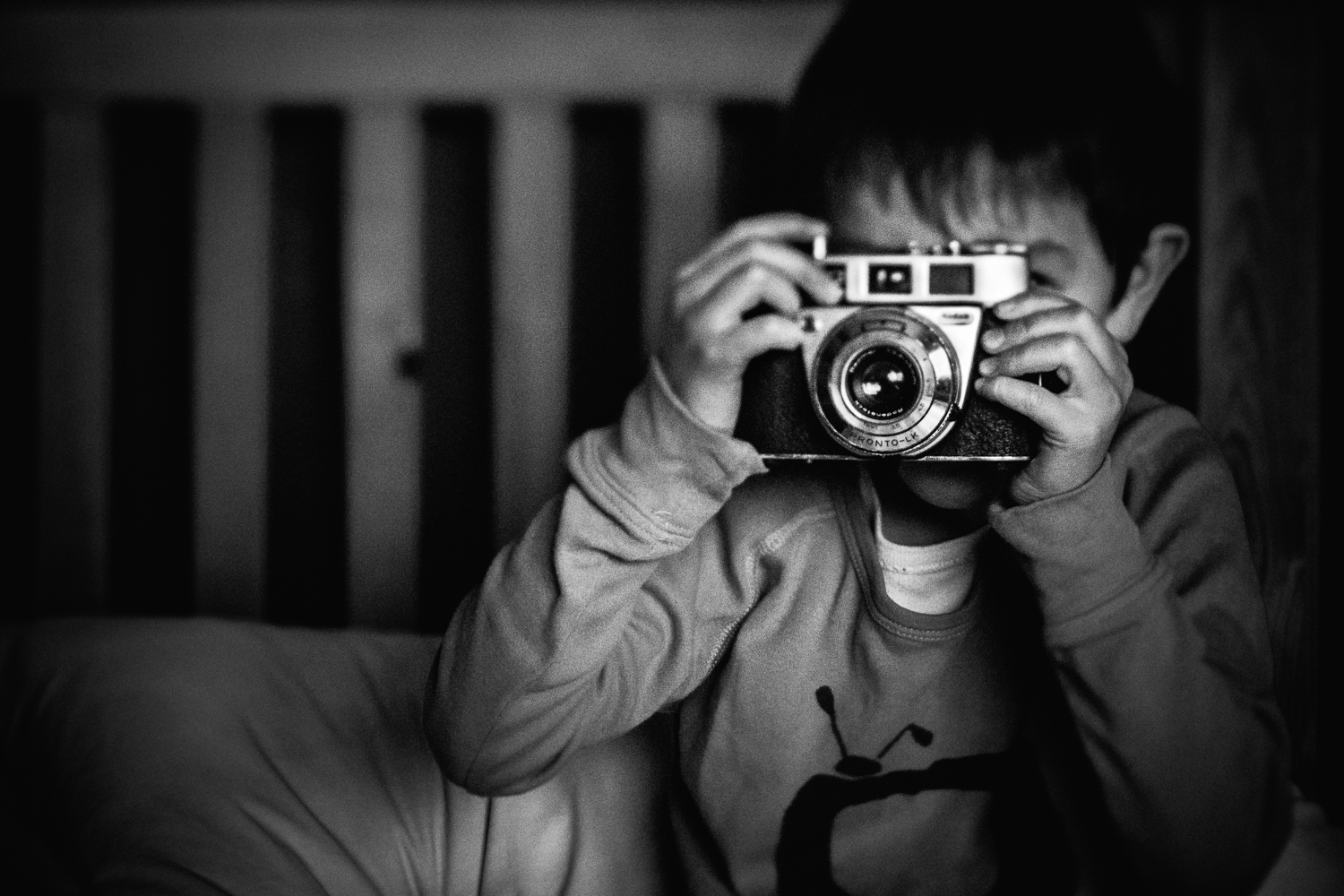 Boy with a vintage Kodak retinette camera