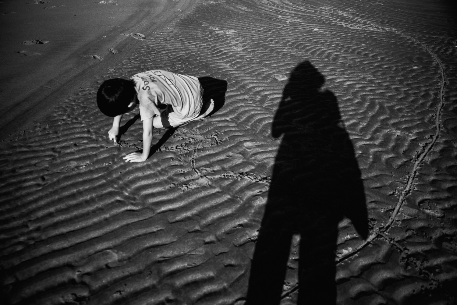 Shadow play on the beach on Lindisfarne, Northumberland