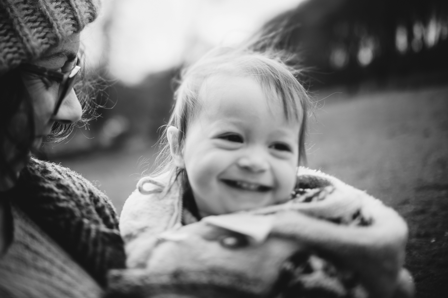 Copy of Backlit photograph of a toddler in her mother's arm