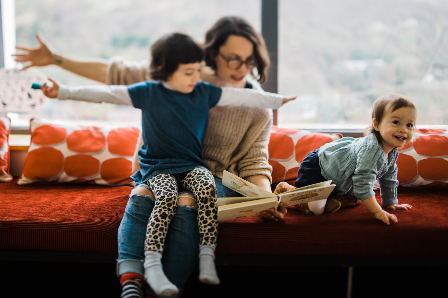 Copy of Freelensed photograph of a mother reading to her children while 