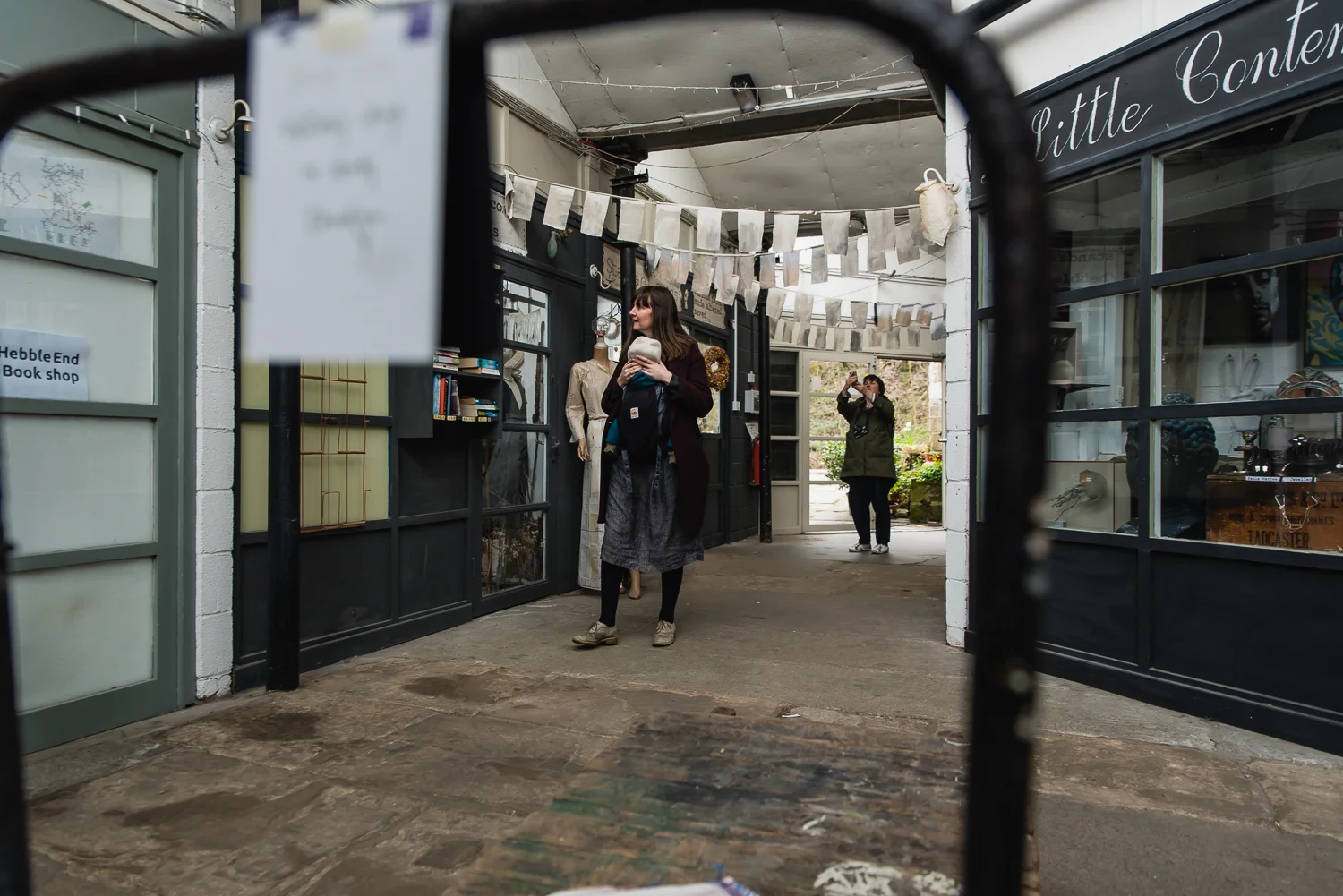 Family walking in a shopping arcade on a fmaily photoshoot in He