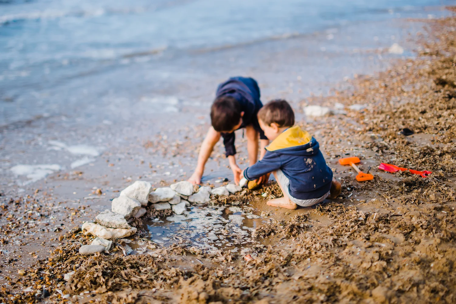 Digging pools on Old Hunstanton Beach, Norfolk, by Diana Hagues