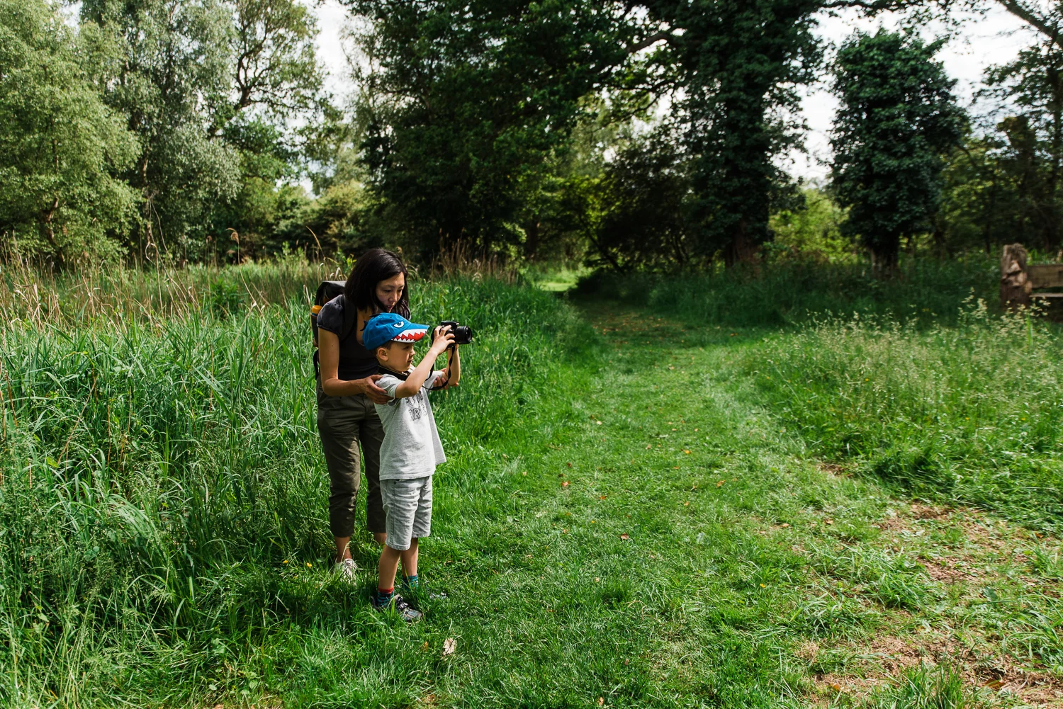 Family out exploring Woodwalton Fen in the summer by Cambridgesh