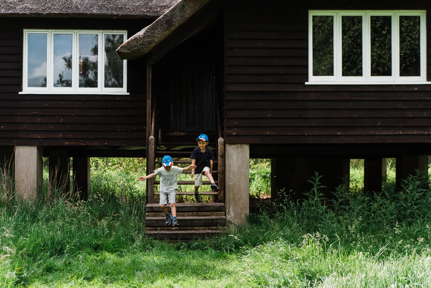 Family out exploring Woodwalton Fen in the summer by Cambridgesh