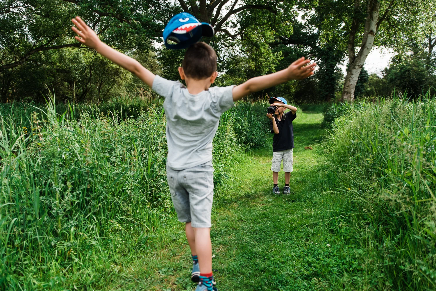 Family out exploring Woodwalton Fen in the summer by Cambridgesh
