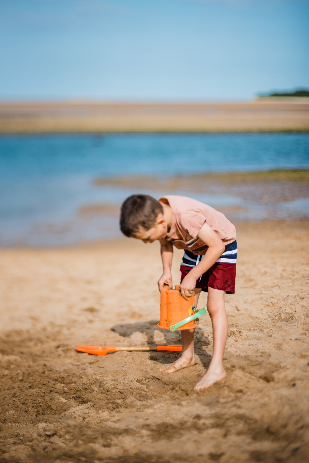  Bucket and spade, sandcastle building, family photography on the beach at Wells-next-the-Sea, Norfolk. 