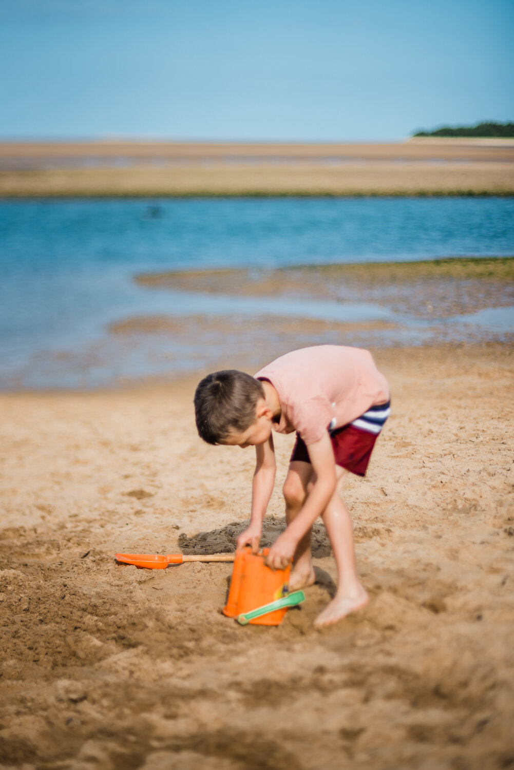  Bucket and spade, sandcastle building, family photography on the beach at Wells-next-the-Sea, Norfolk. 