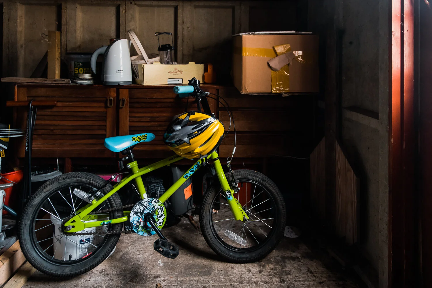 Green bike in a shed