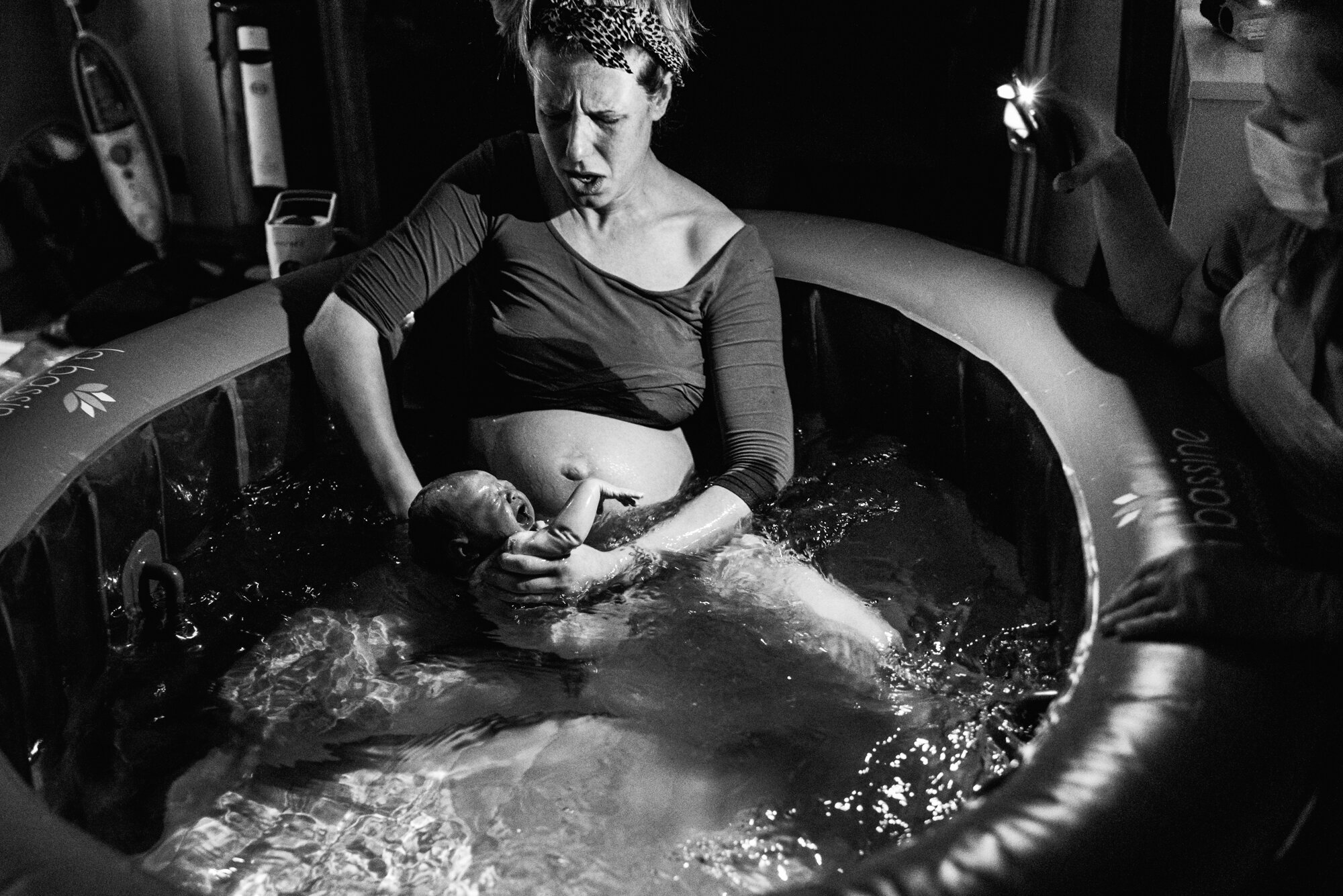  During the Covid pandemic and UK lockdown, a white British woman gives birth to her baby girl in a birthing pool at her home in Cambridge, Cambridgeshire. 