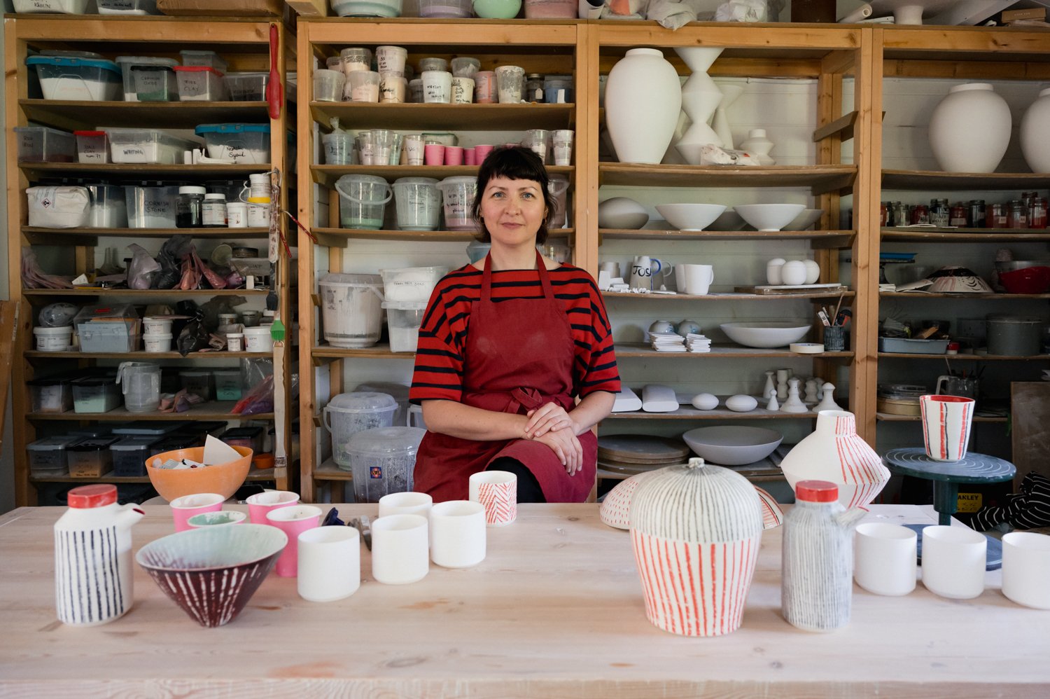  Katharina Klug of Klug Ceramics surrounded by her pottery pieces in her pottery studio in Cambridge. 