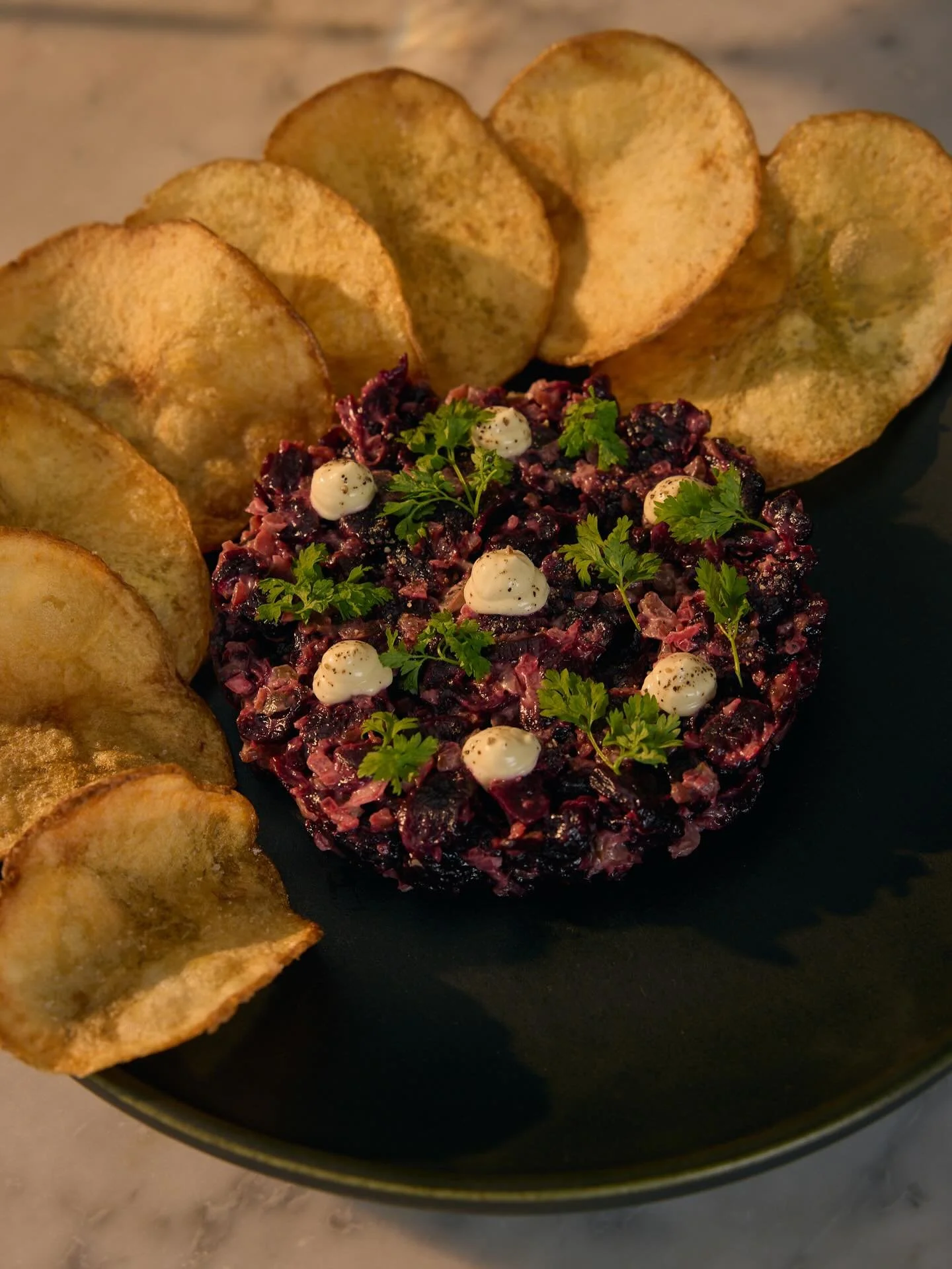 smoked beet tartare (v, gf+)

an updated version of a dish we loved from many seasons ago. classic red beets go through a long process of boiling, smoking, roasting, dehydrating, rehydrating, to create this perfect chewy texture. mixed to order with 
