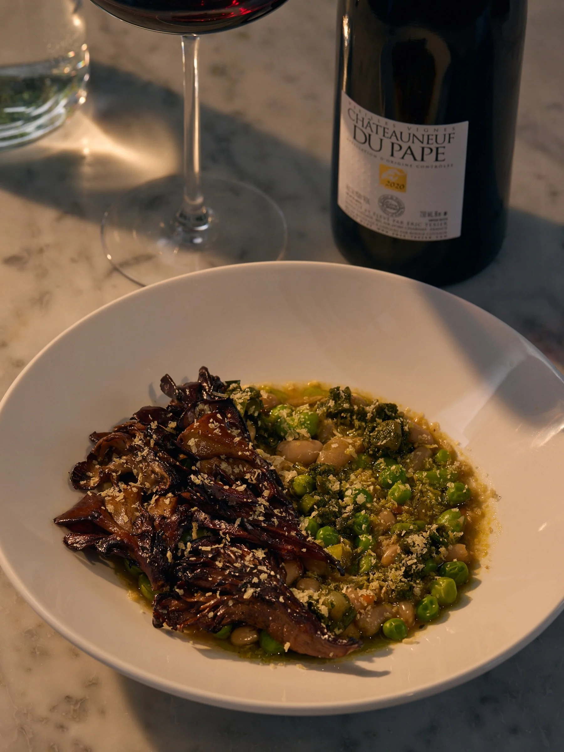 we&rsquo;ve played around a few times with the cassoulet - a cozy, humble legume + meat dish out of the languedoc - and this time we wanted to keep ours a bit more spring focused with the addition of fava beans, green garbanzos + english peas, paired