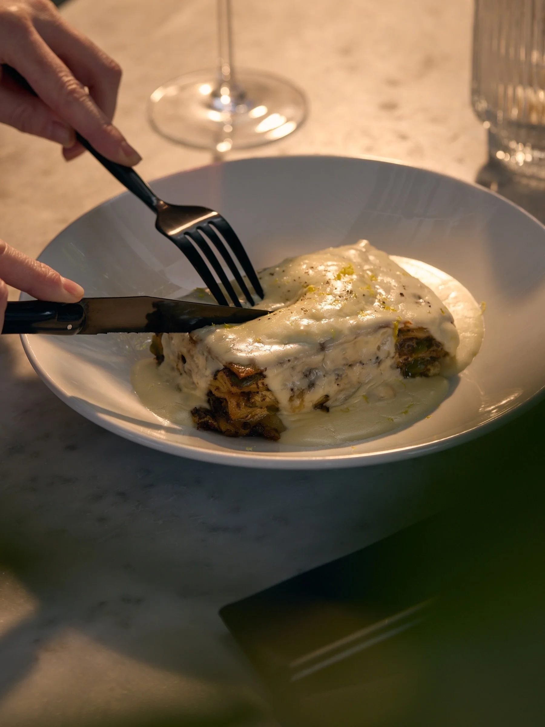 layers of love. our white lasagna starts with a ragu bianco base with a healthy dose of fennel seed, spiked with salty castelvetrano olives, topped with ricotta, parmesan, pecorino, on repeat + stacked high. finished off with a slice of mozzarella, p
