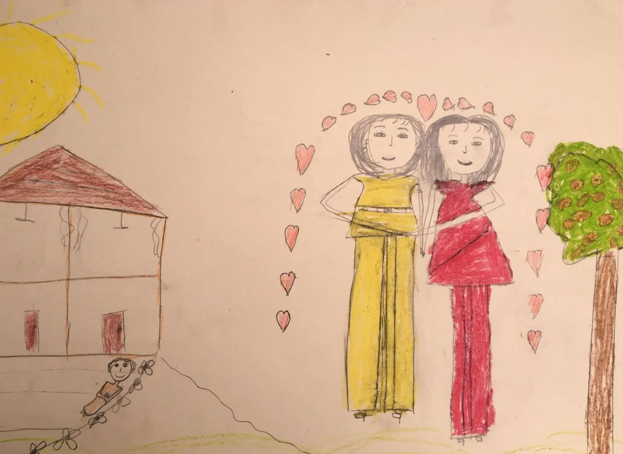 A drawing by a 9-year-old girl living in poverty in a home made of metal cans with her sisters and mother. Her picture reflects her dreams of a house and family.