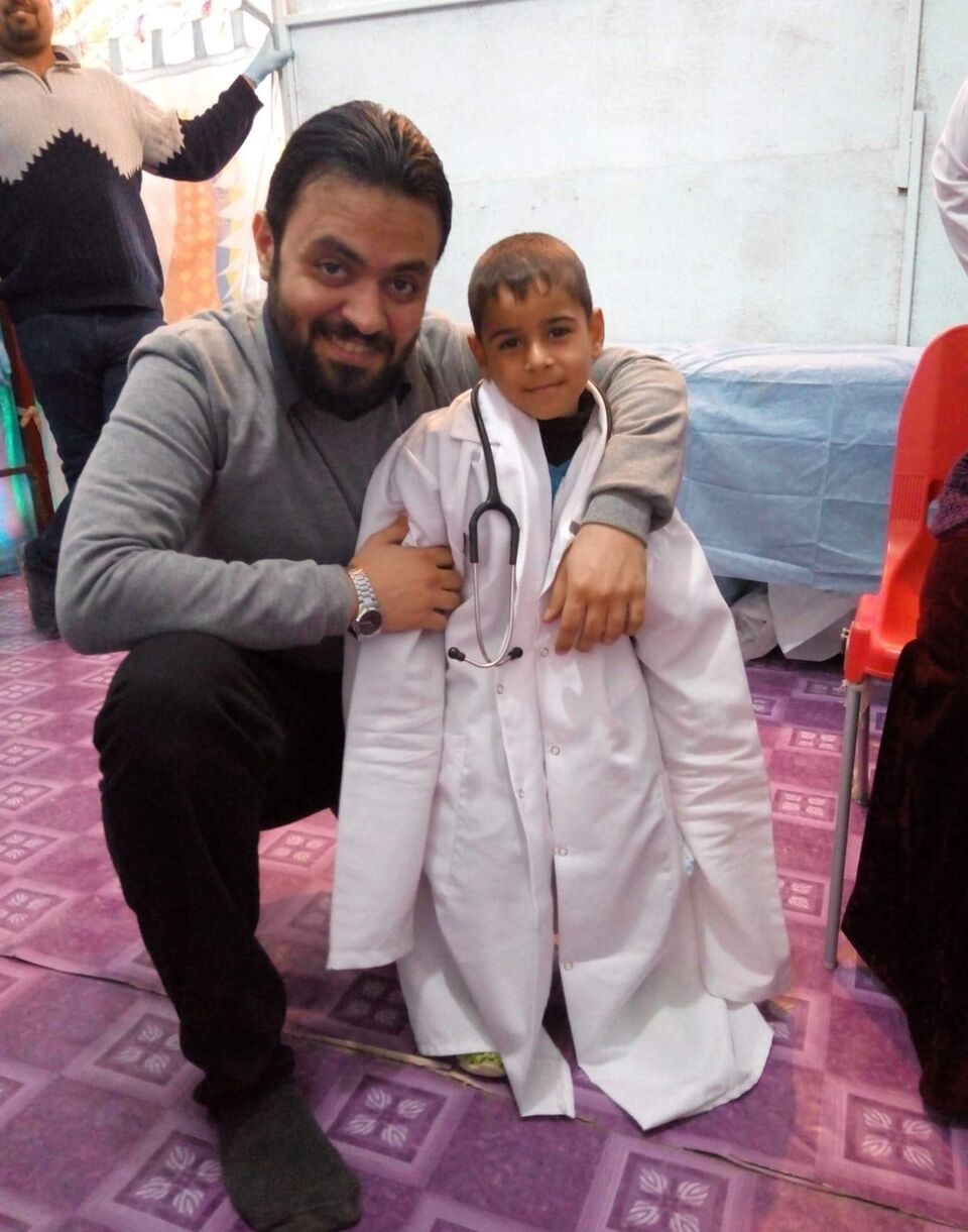 Dr Mustafa with little Dr. Moayad.jpg