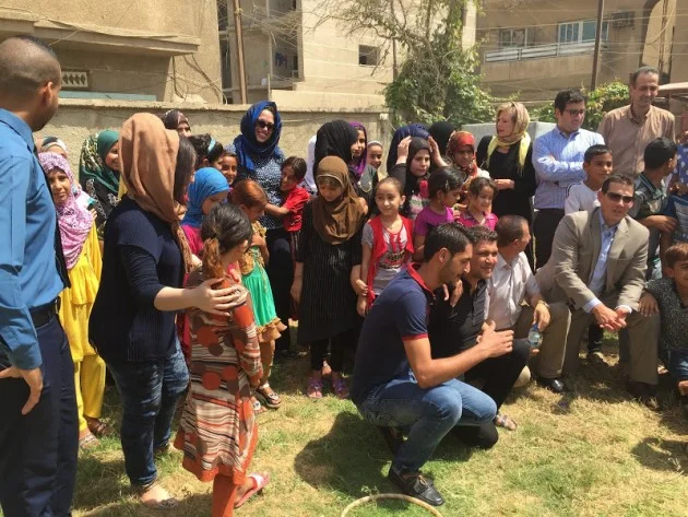 Gathering the kids, staff, ICF and CV for group picture at the Center