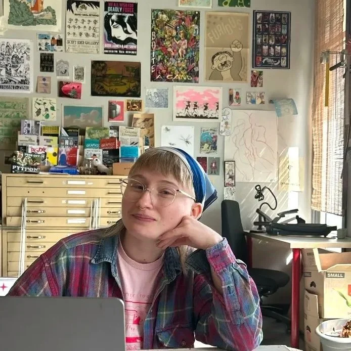 Meg Lentz with their laptop at the SAW studio
