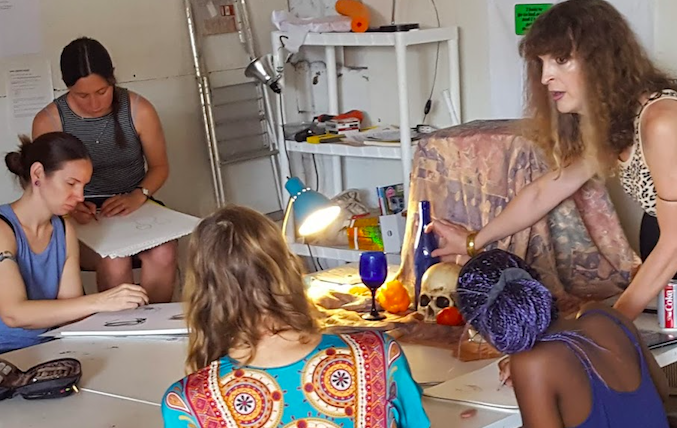 Justine brought out skulls, bottles and other still life material and had them working on form and light and value.