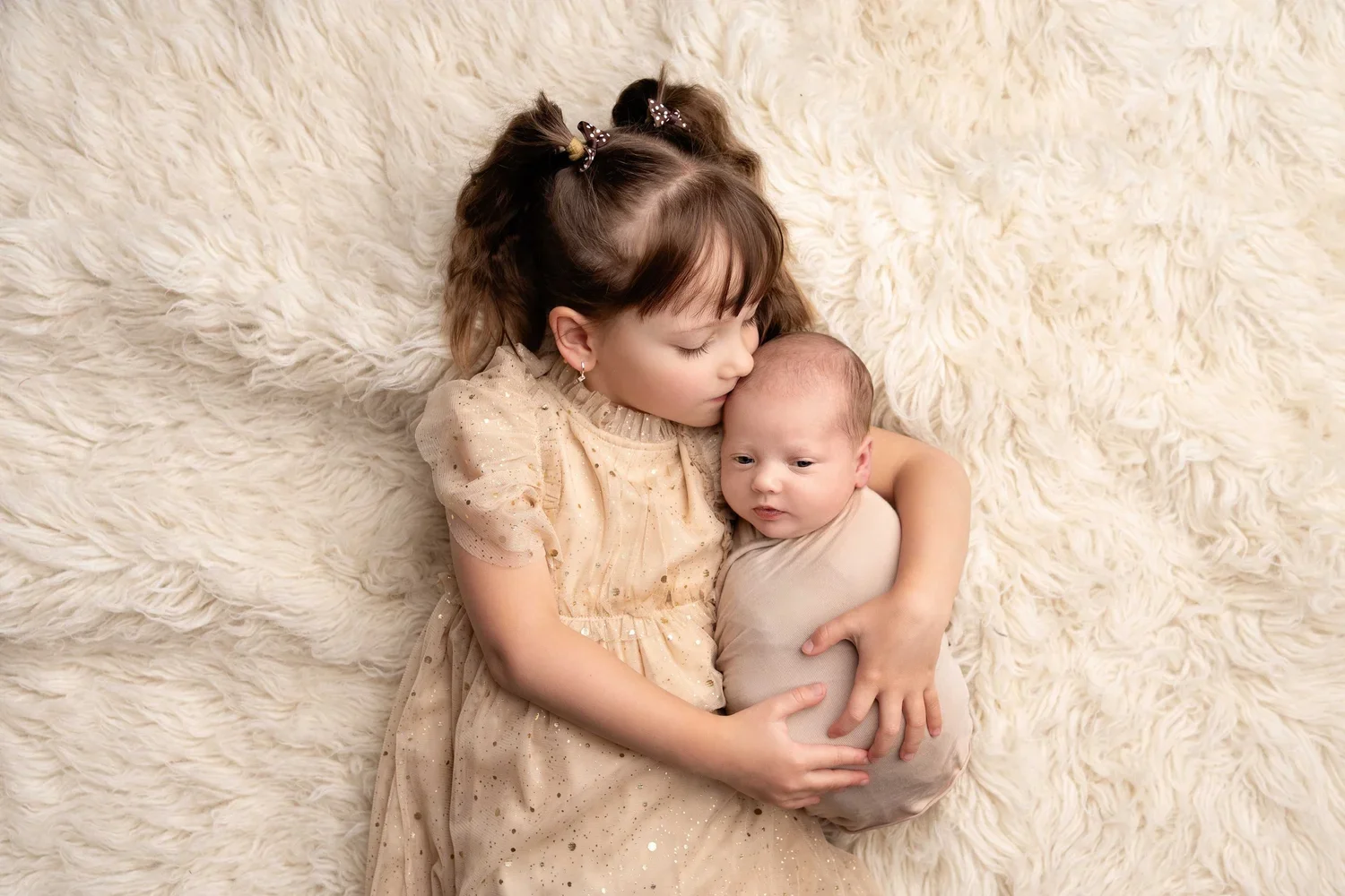 sleeping newborn wrapped in neutral blanket studio portrait Willenhall newborn photographer