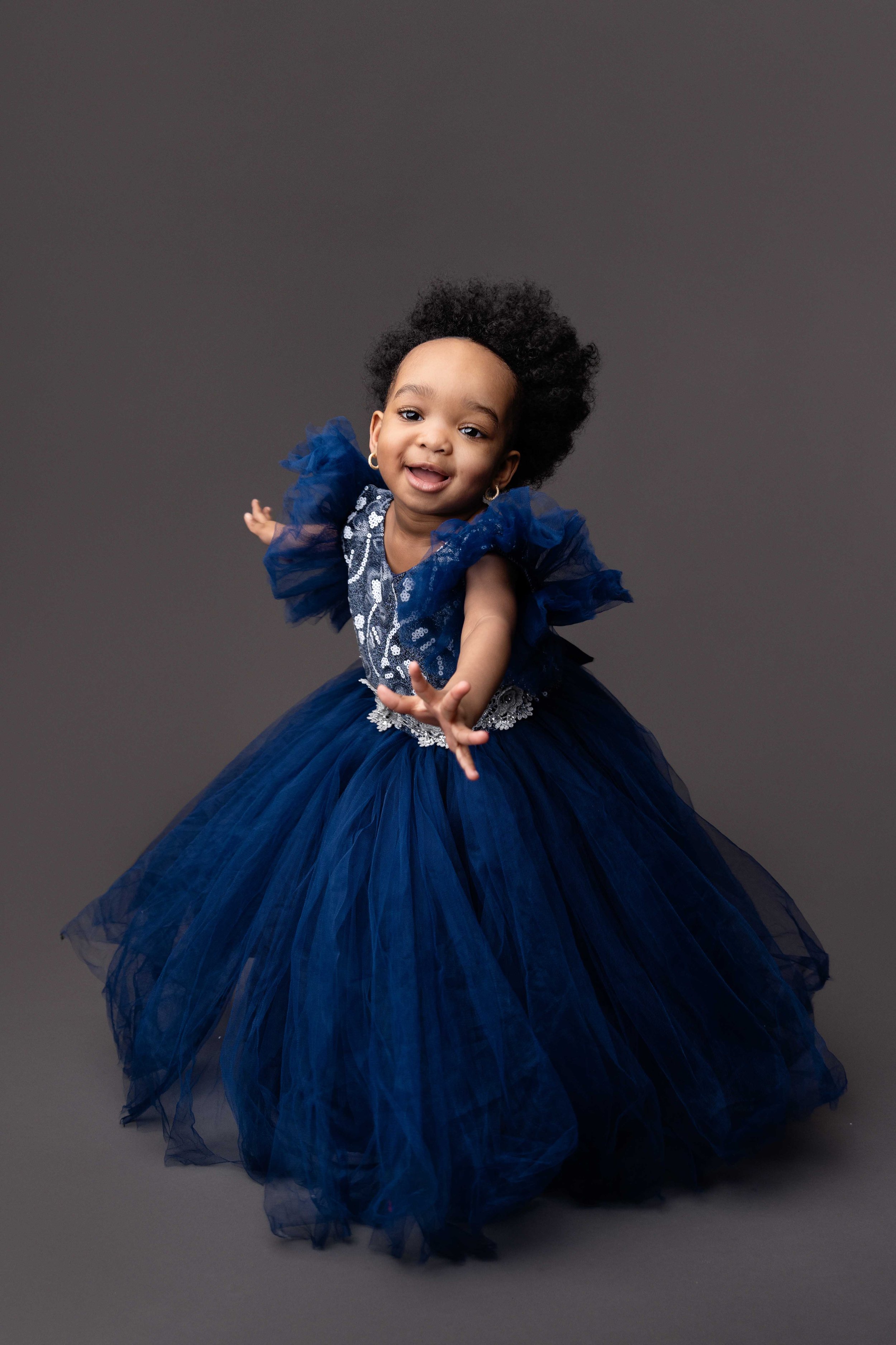 girl dancing during her childrens photoshoot with lea cooper photography in willenhall within the west midlands