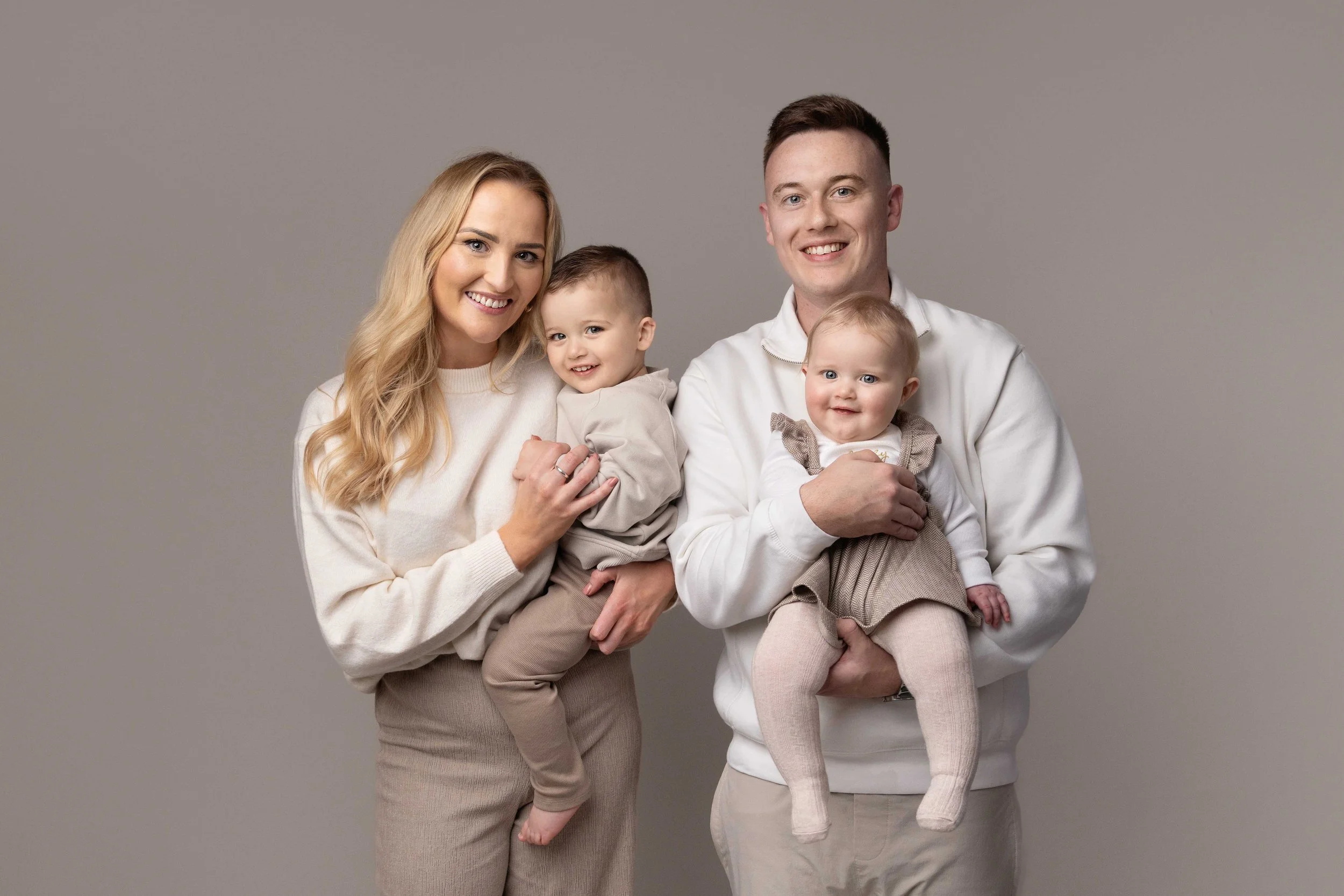 family having their photo taken during a family photoshoot in birmingham, west midlands uk