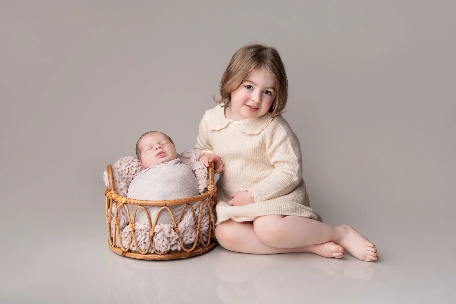 sibling holding newborn baby portrait Willenhall family newborn photos West Midlands
