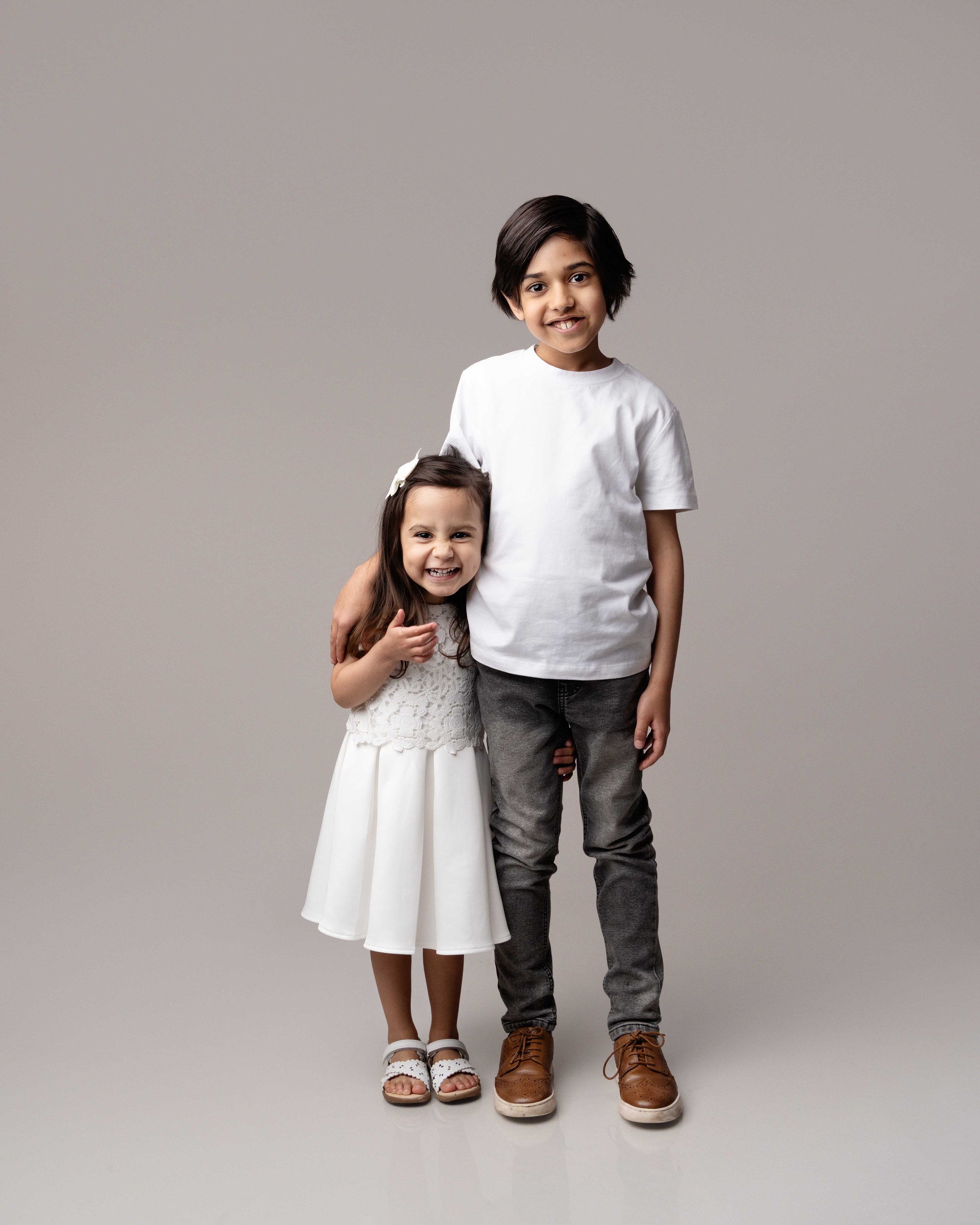 siblings at family photoshoot with lea cooper photography in willenhall near birmingham in the west midlands