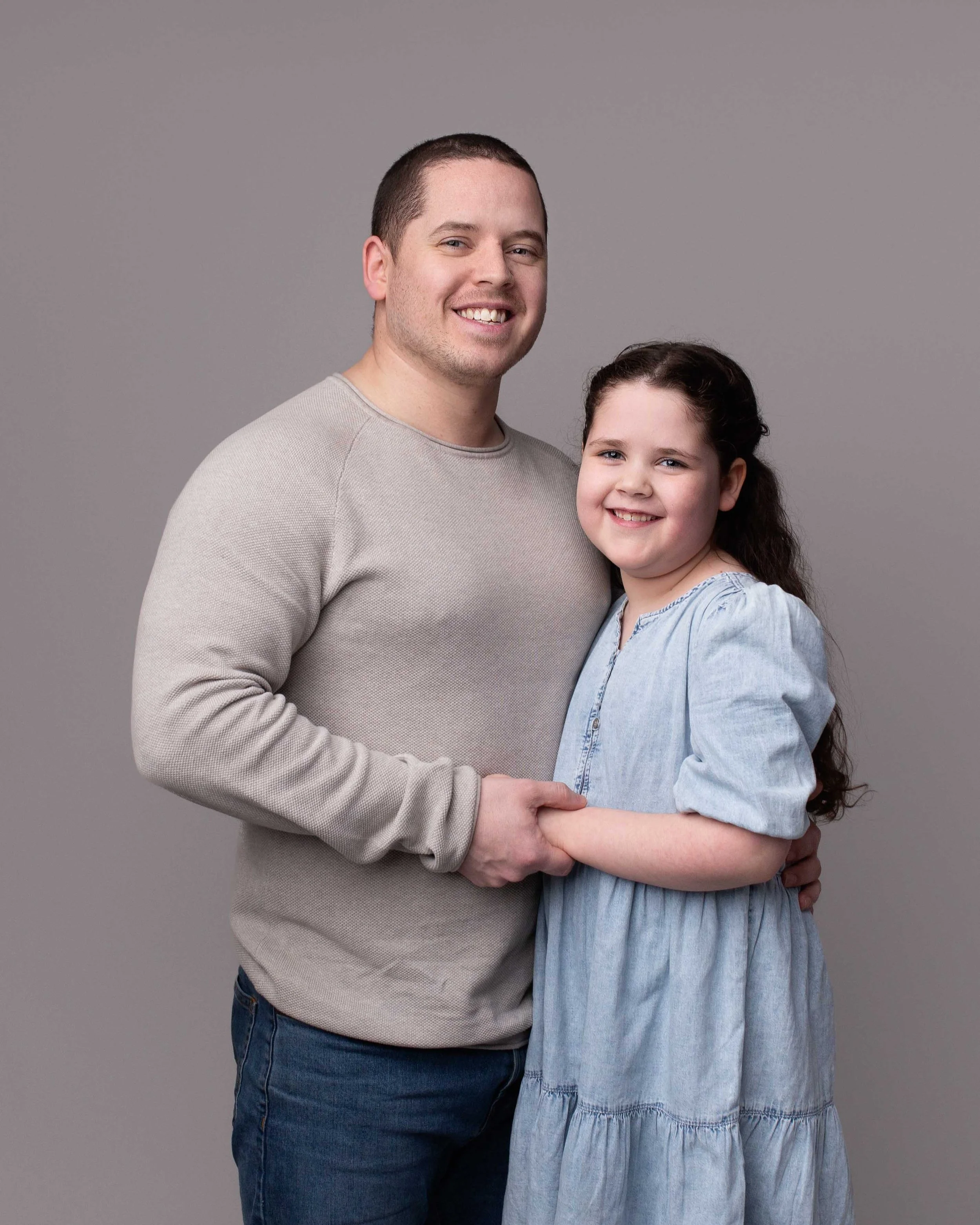 Family photography session with father and young daughter at Lea Cooper Photography studio in Willenhall, West Midlands