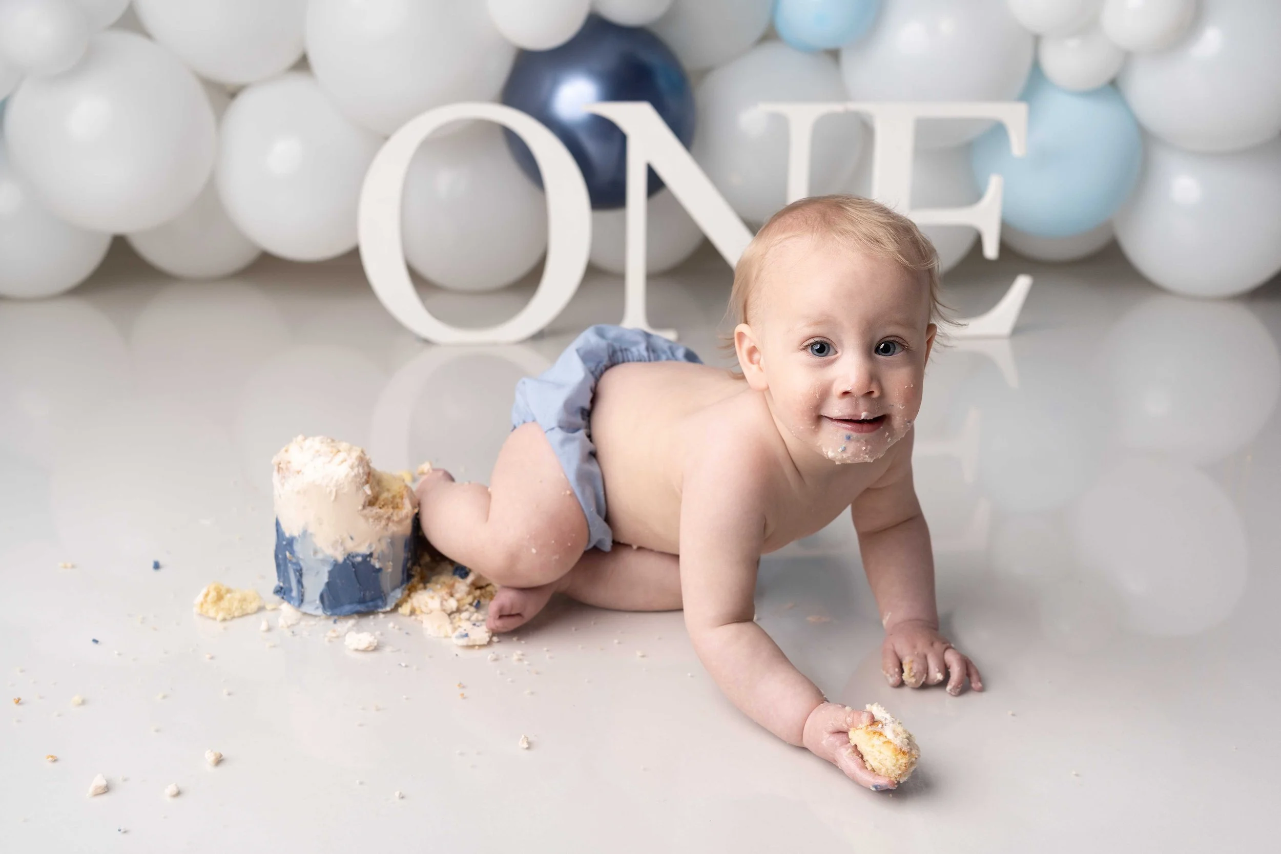 Baby cake smash photography with custom styling serving Birmingham