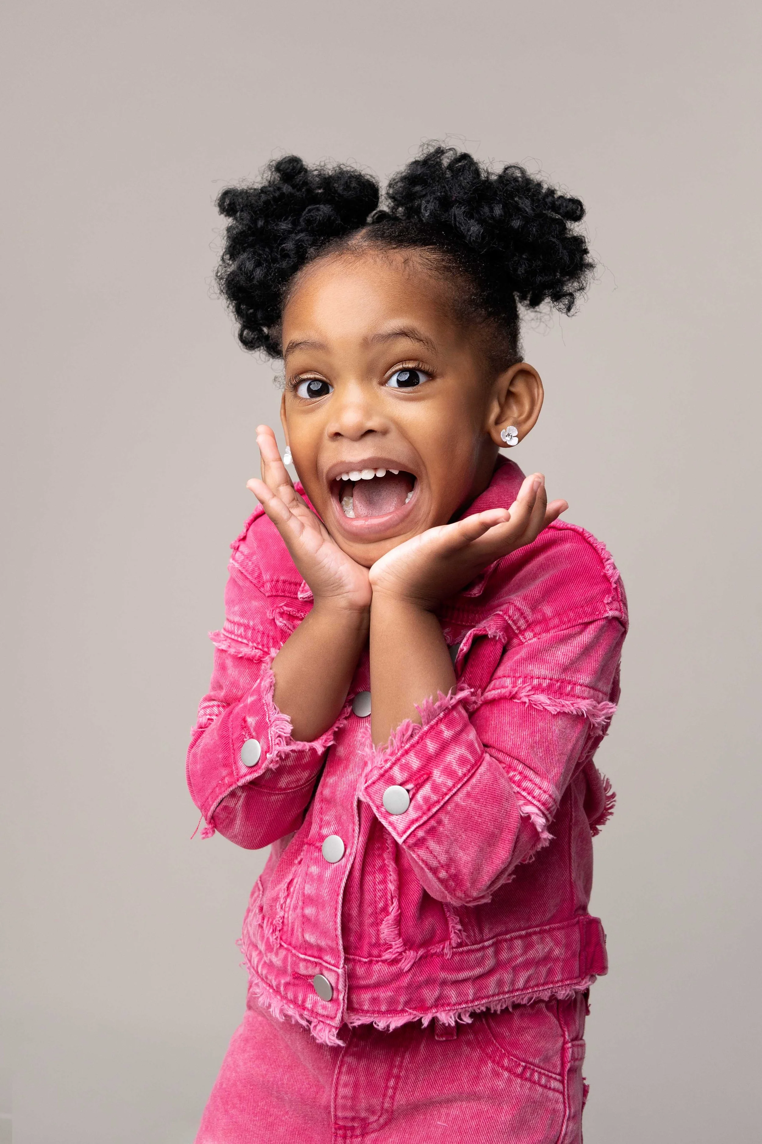 girl wearing pink pulling face during her photoshoot with childrens photographer in willenhall - wolverhampton - west midlands