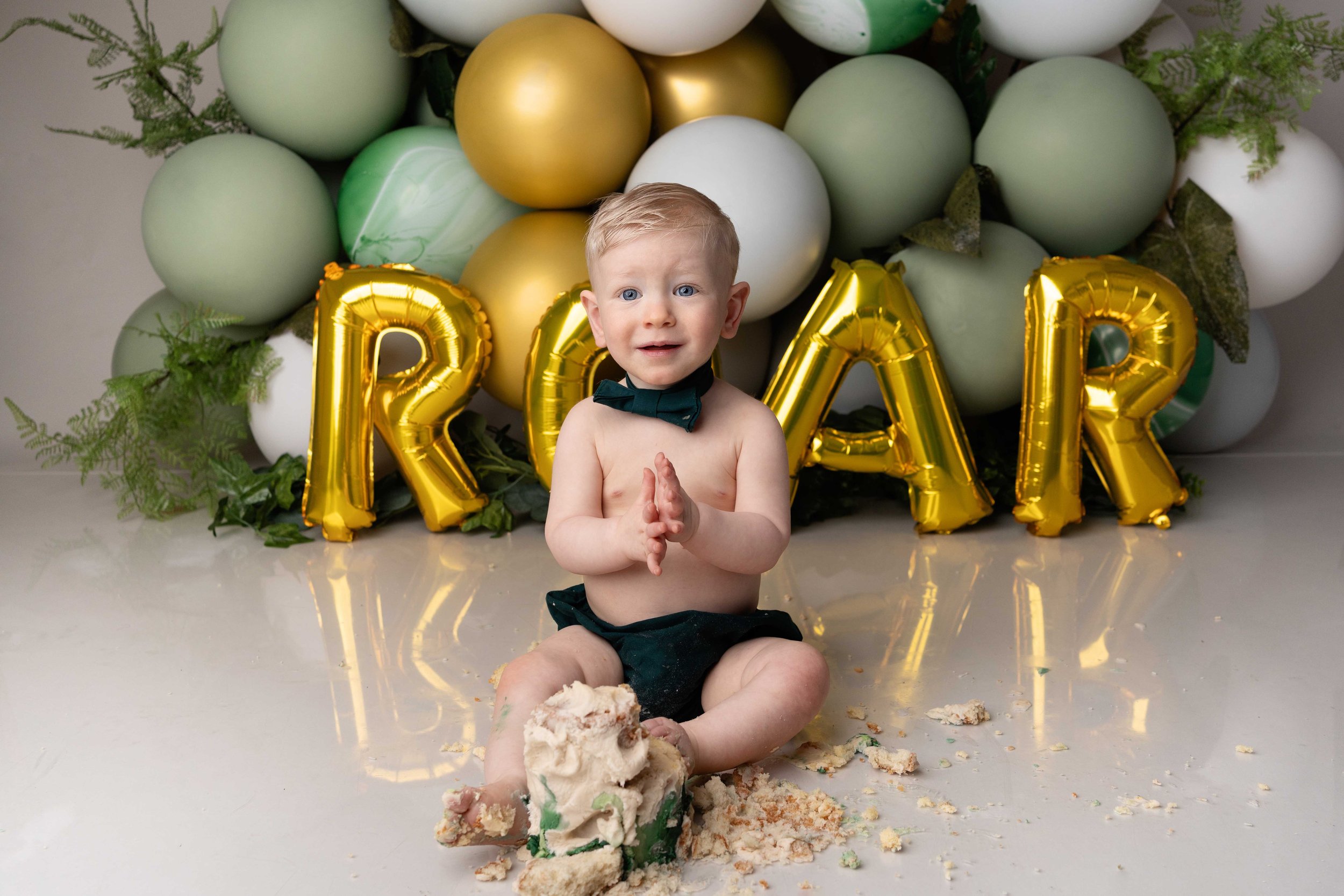 Cake smash photography session for a first birthday serving Birmingham families