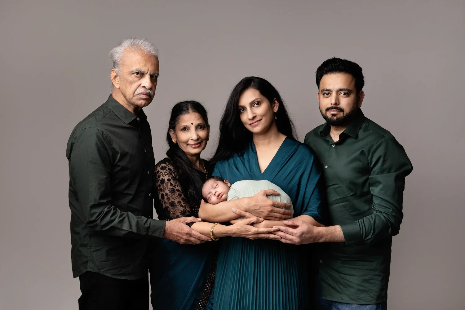 parents holding newborn baby studio portrait Willenhall Wolverhampton newborn photography