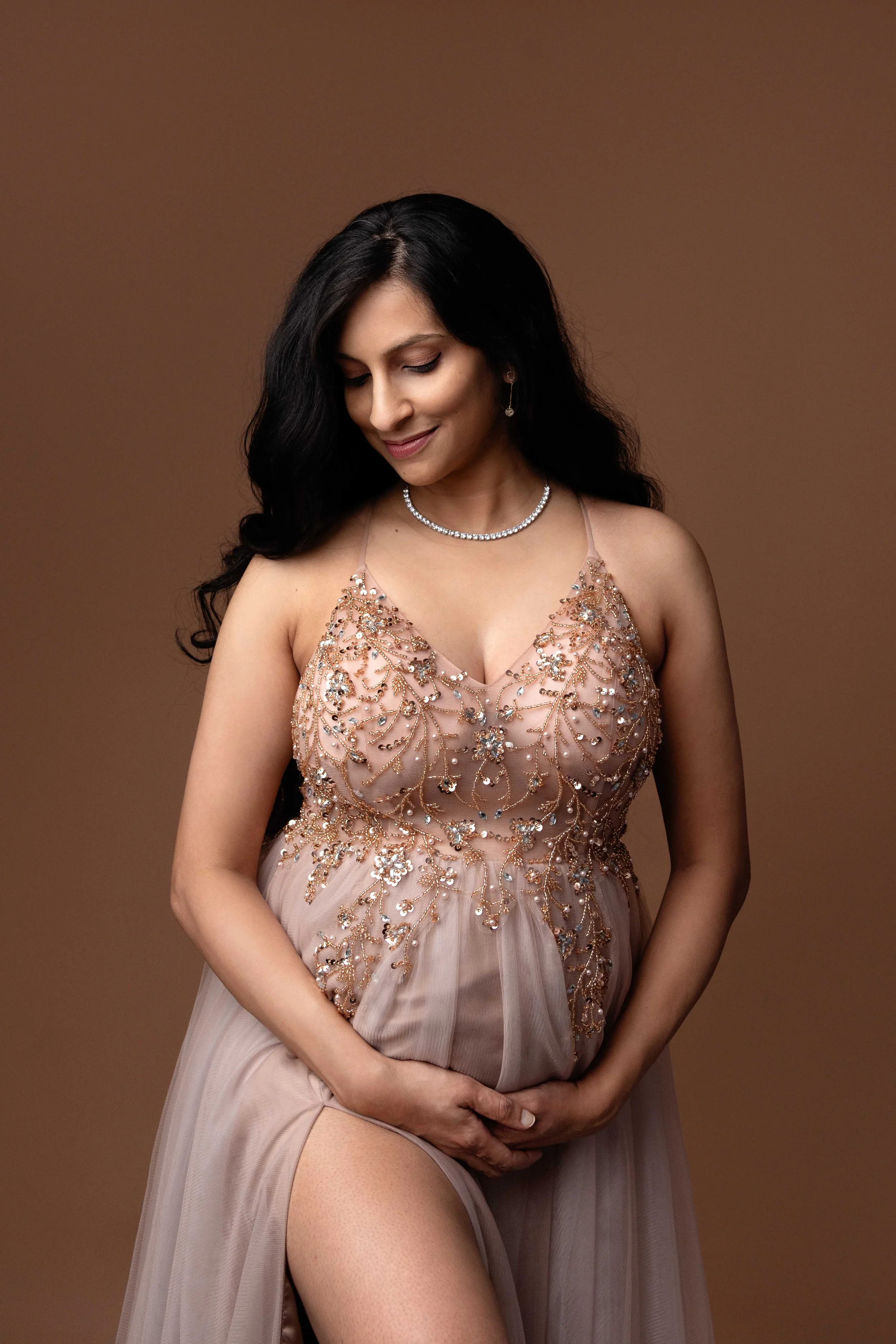 Professional maternity photography capturing a growing bump