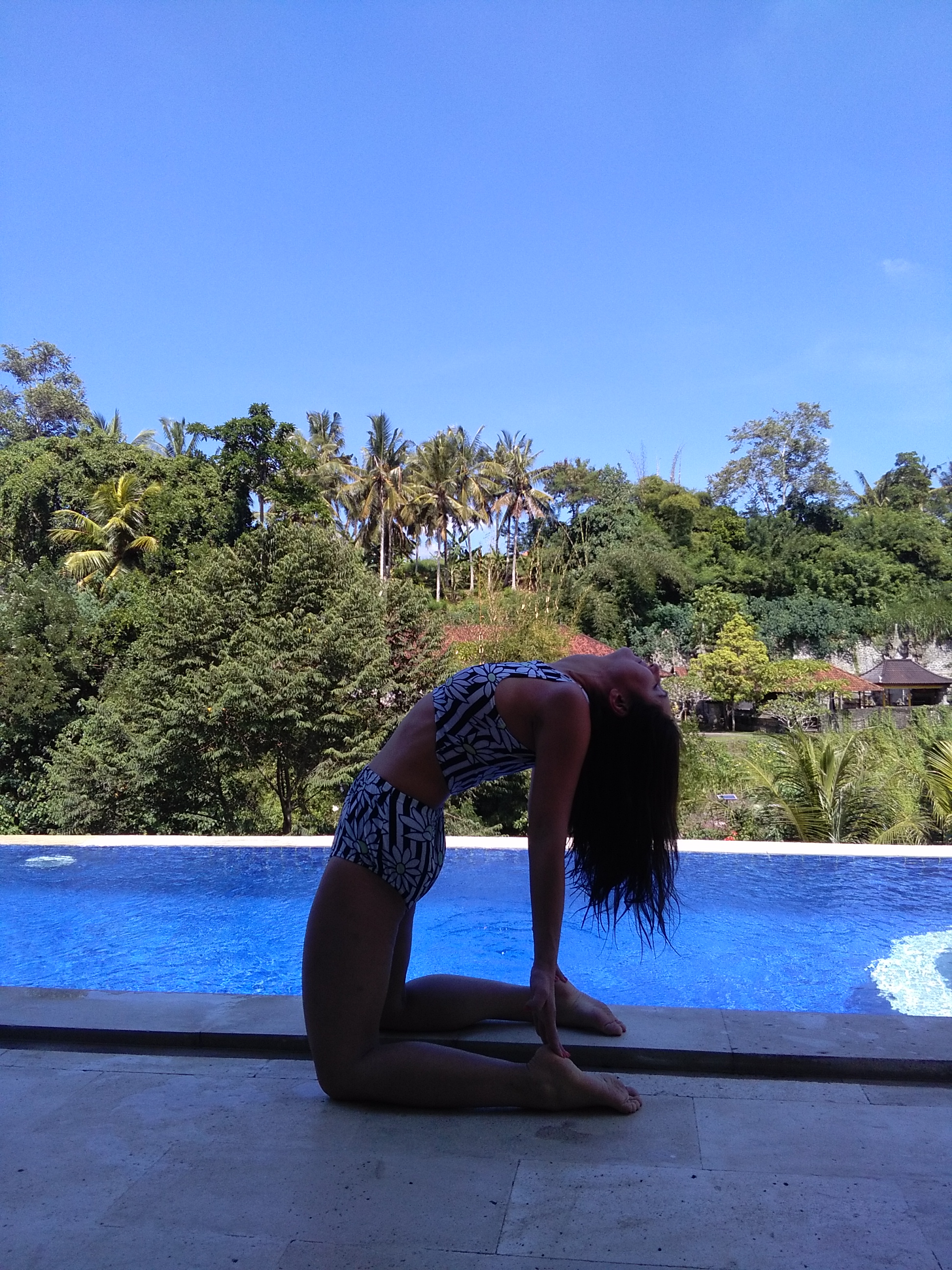Evening yoga by the pool