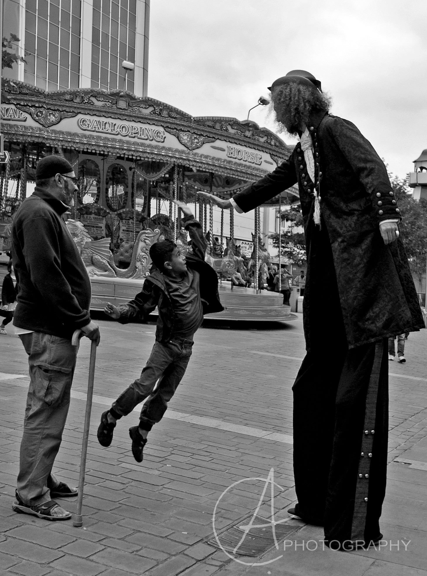 Walkabout Circus Performers and Street Theatre: Stilt walker high five