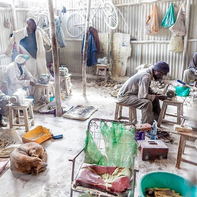 Men working inside Victorious Bones Craft - a workshop in Kibera where bones are recycled to make wonderful jewelries and other accessories. Photo by Bryan @kiberastories. #everydayafrica #reclaimphoto