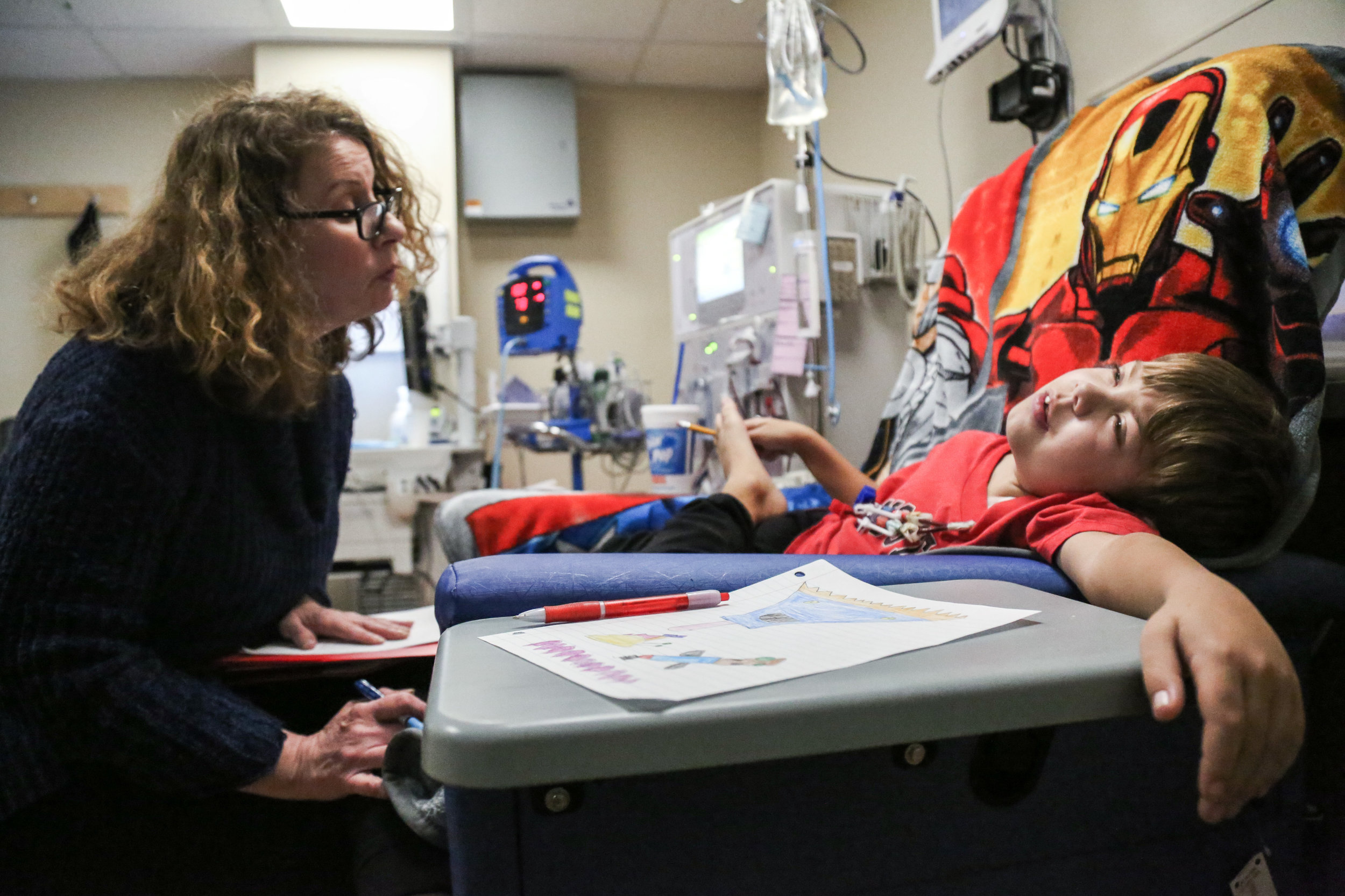 Harrison has hemodialysis treatment for 3-4 hours, three times a week. He has been taking treatment in the UNC hospital for over five years. Karen Weatherly, one of the hospital school teacher, stays with him every time he visits. She has almost become his family member.