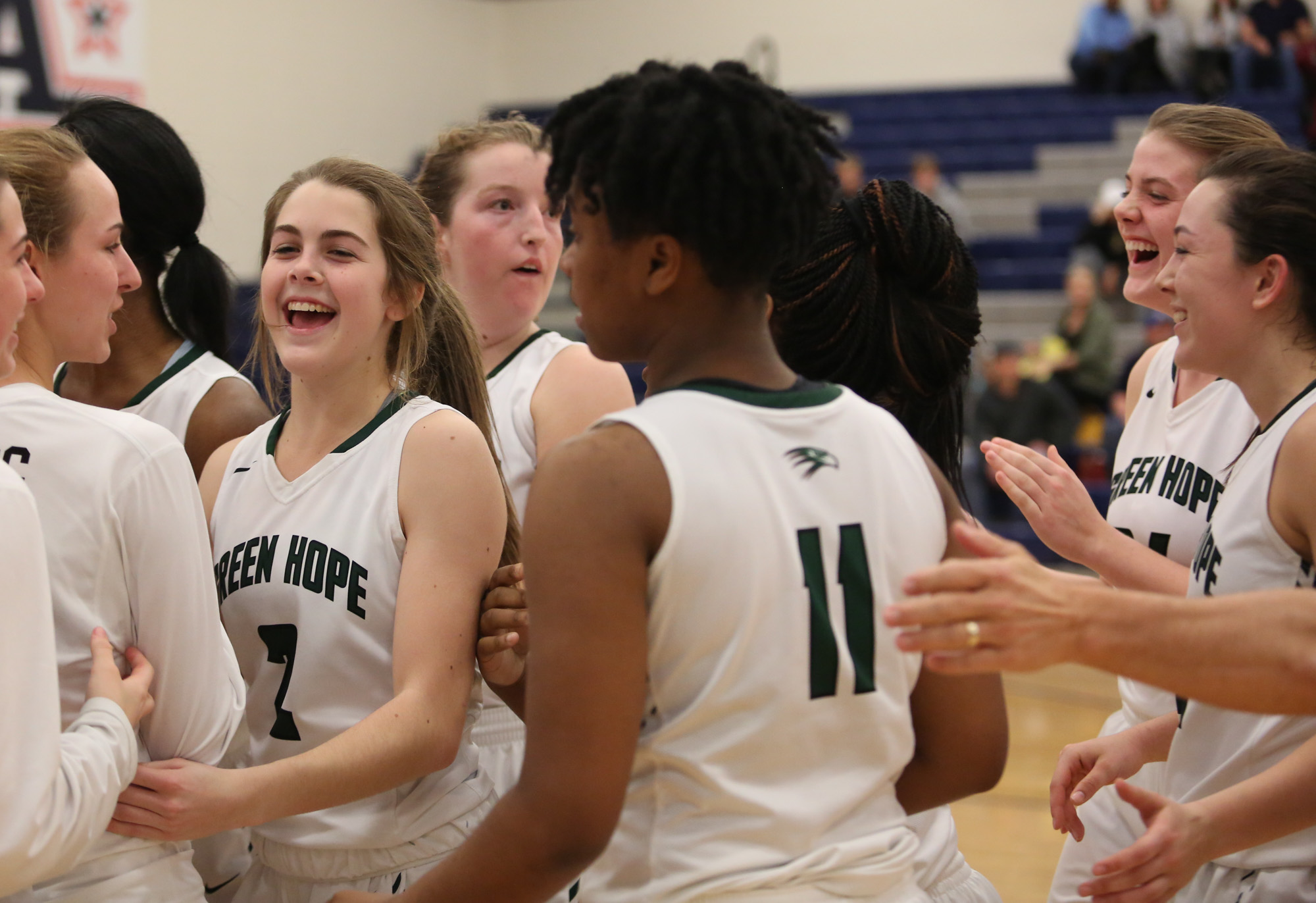  Green Hope girls celebrate after they won against Holly Springs, 50-49, for the Conference Tournament Championship on Feb.17, 2017. 