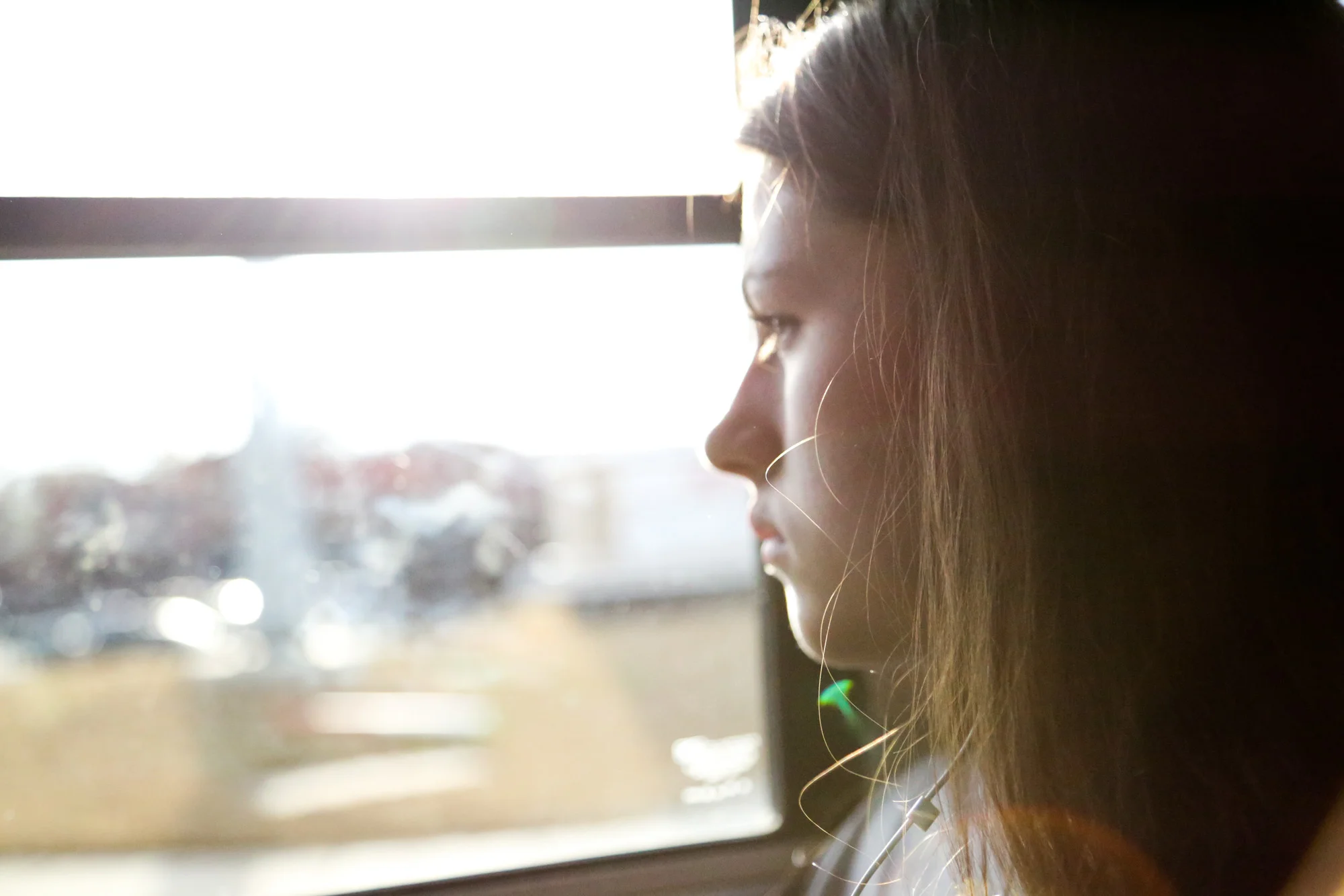 Emily Wynne looks outside through the school bus window after having snacks on their way to Athens Drive High School on Feb.10, 2017.