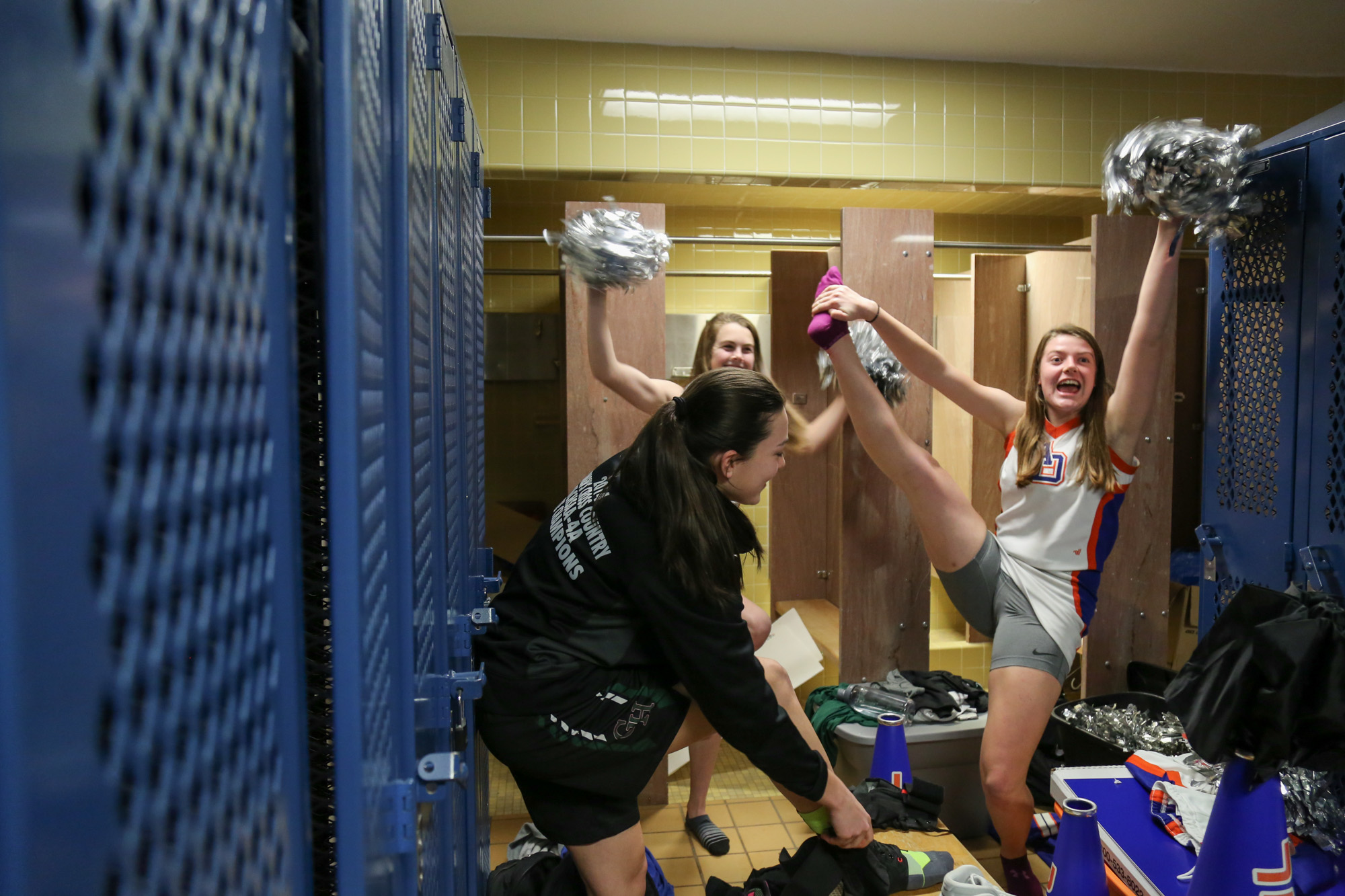  Green Hope's Emily Schoeffler and Catherine Holbrook dance for fun in the locker room before their game with Athens Drive High School on Feb.10, 2017. 