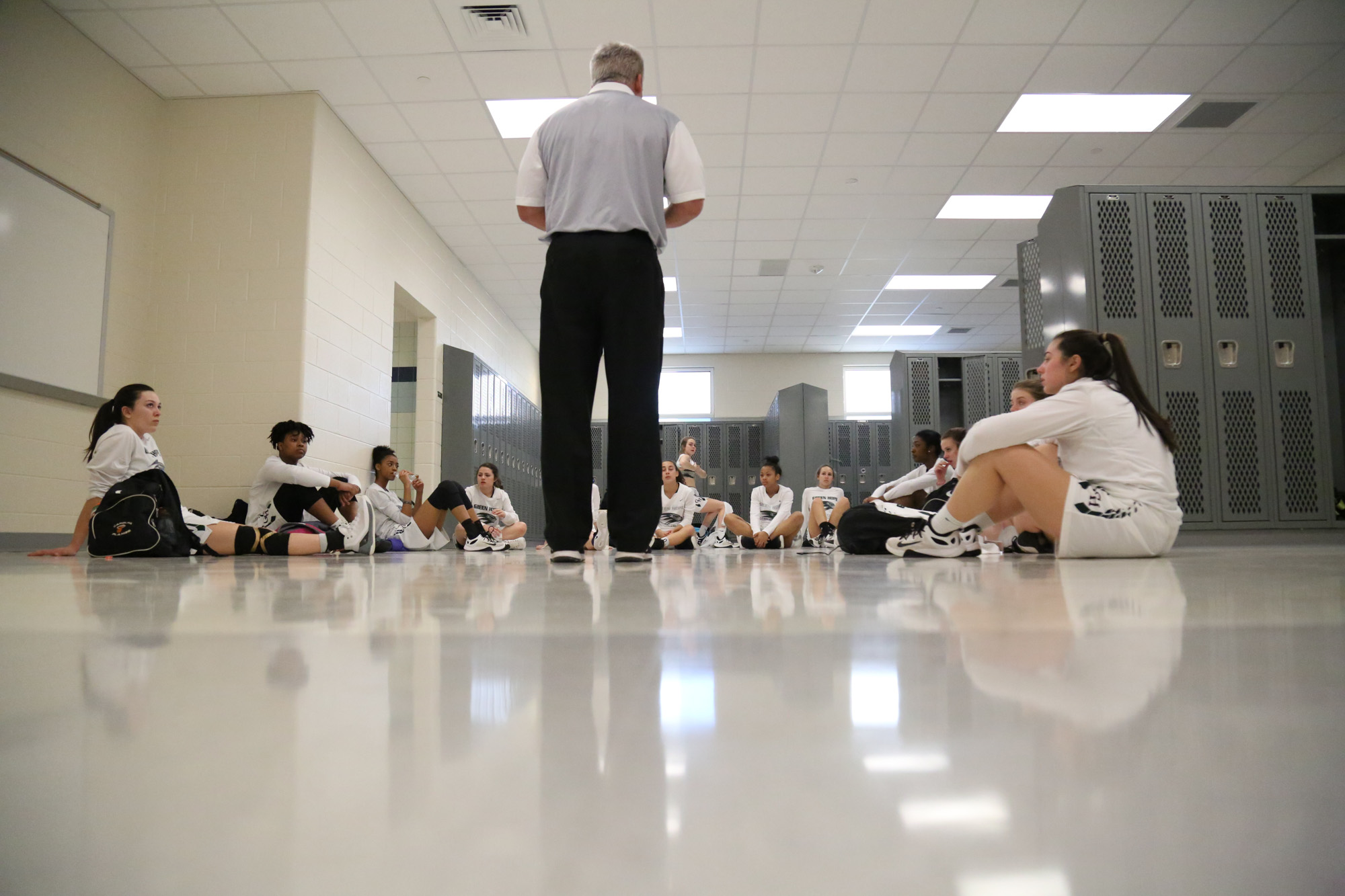  Green Hope's coach Mike Robinson gave instructions to the team in the locker &nbsp;room before the game against Holly Springs on Feb.17, 2017. 