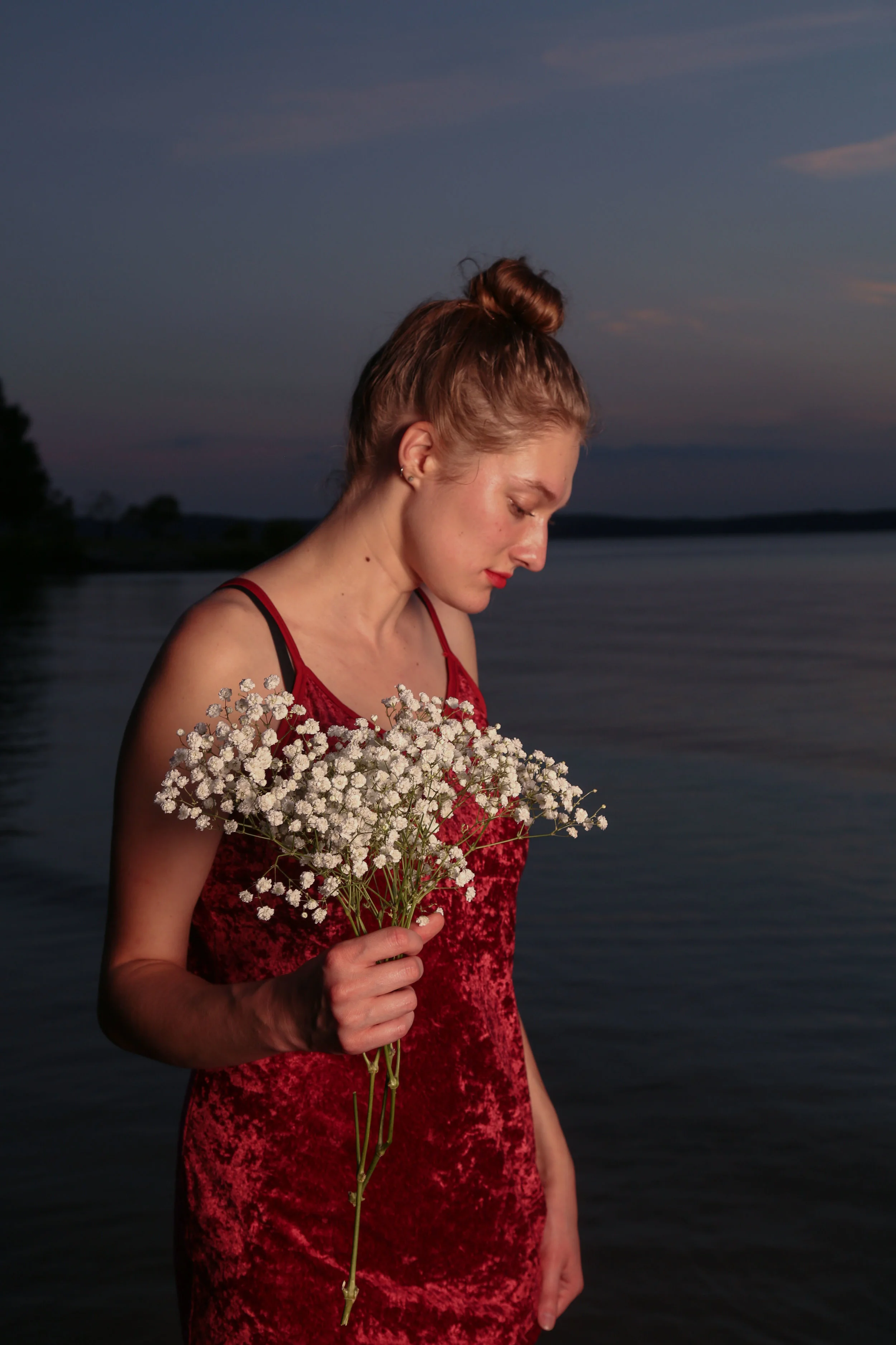 This portrait series was shot in the evening of Sep.16, 2016 at the Jordan Lake, NC, featuring a senior photojournalism student Clair Collins. The red velvet dress is picked on purpose to match the golden hour. 