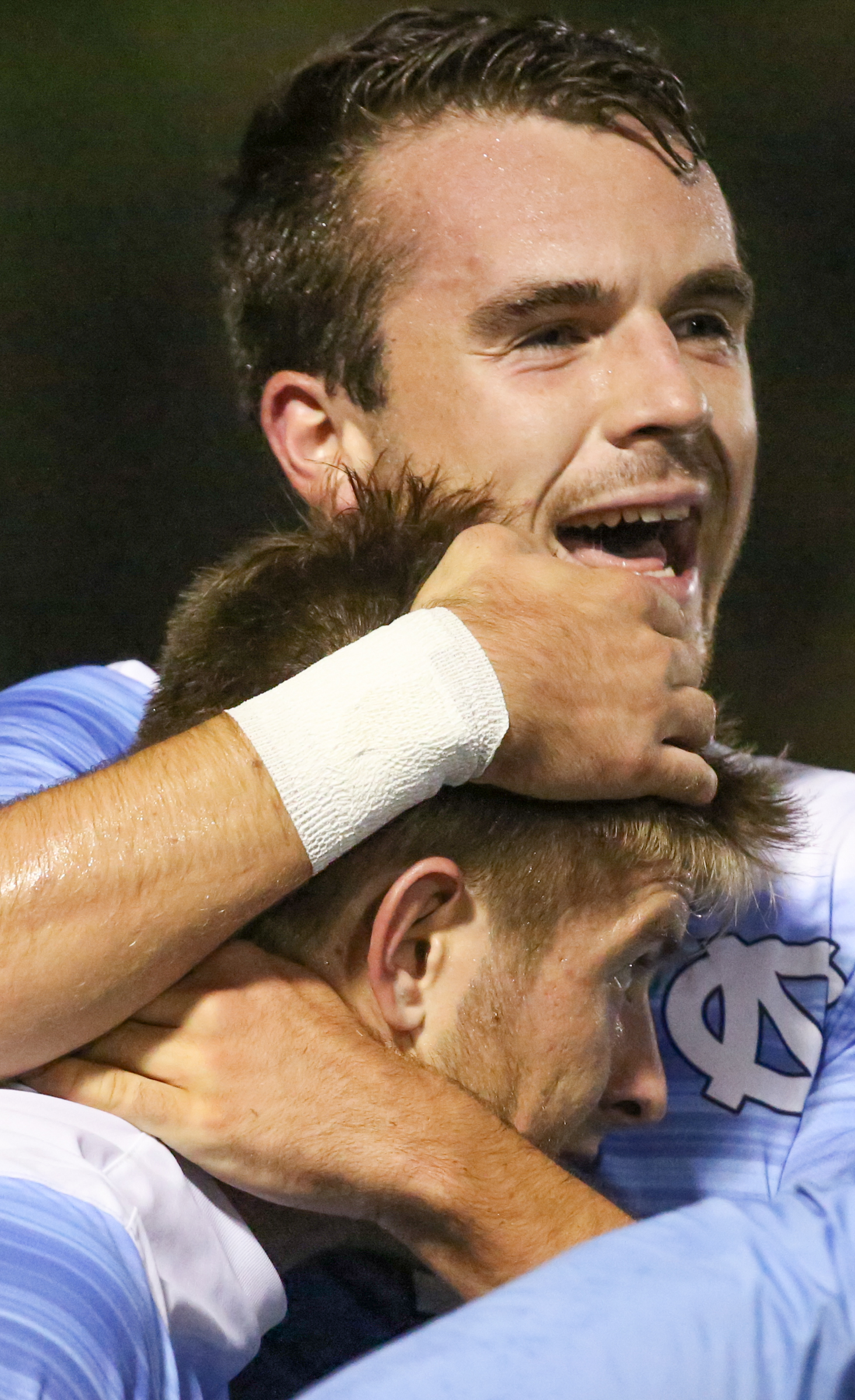  UNC's &nbsp;Alex Comisia hugged Cam Lindley after UNC scored the first goal. UNC defeated Notre Dame 3-0 at Wake Med Soccer Park in Cary, NC on Friday, Oct.27, 2017. 